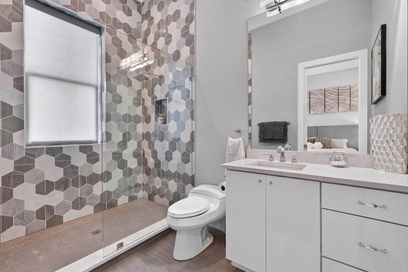 304 YACHT HARBOR DRIVE, Palm Coast, FL 32137 The private ensuite continues the clean, contemporary design with an oversized walk-in shower and beautiful tile detail.