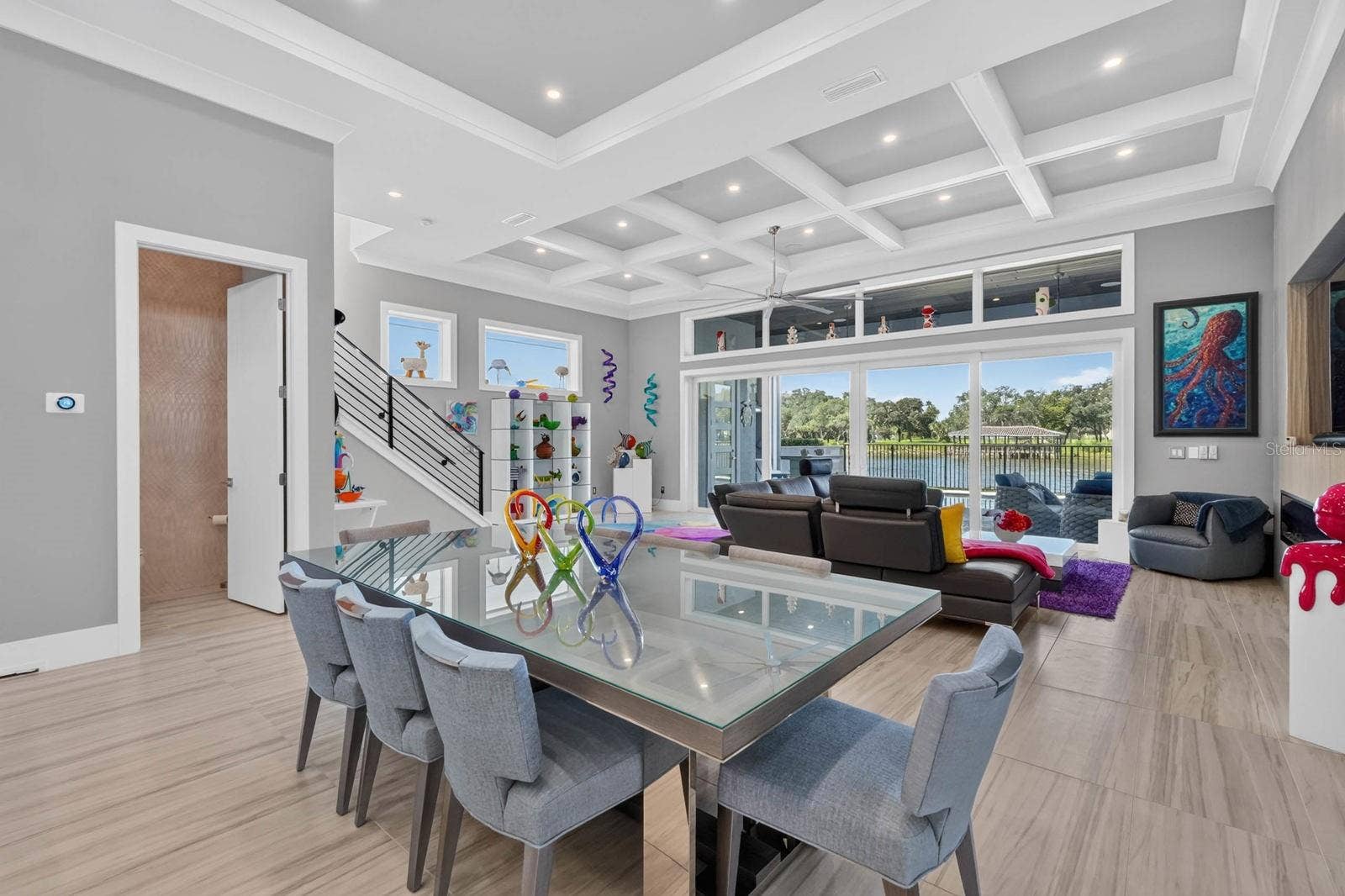 304 YACHT HARBOR DRIVE, Palm Coast, FL 32137 Soaring ceilings, detailed millwork and walls of glass give the main living level its sense of scale, while the open design keeps the water beautifully in view.