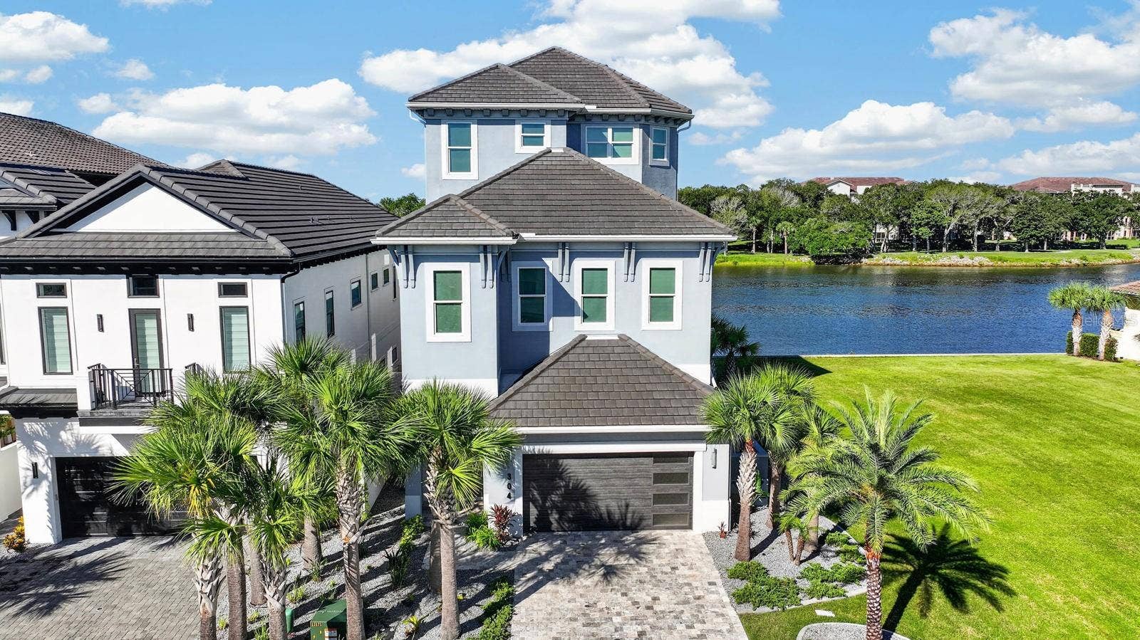 304 YACHT HARBOR DRIVE, Palm Coast, FL 32137 Three levels designed around the water. This 4,150 SF residence lives large, with expansive Intracoastal views and outdoor living from every level.