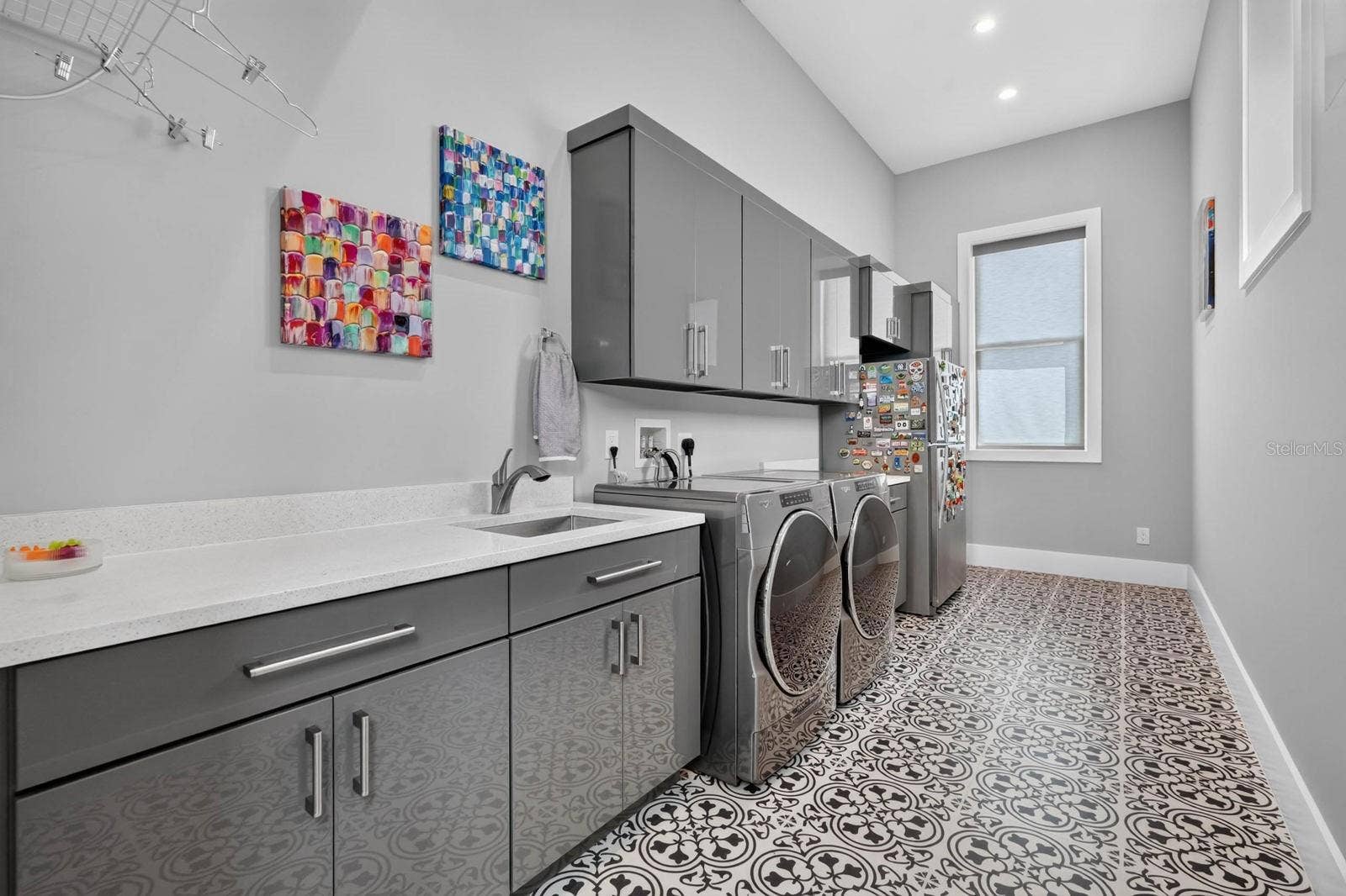 304 YACHT HARBOR DRIVE, Palm Coast, FL 32137 Even the laundry room was given room to workgenerous cabinetry, expansive counter space, utility sink and plenty of space for everyday organization.