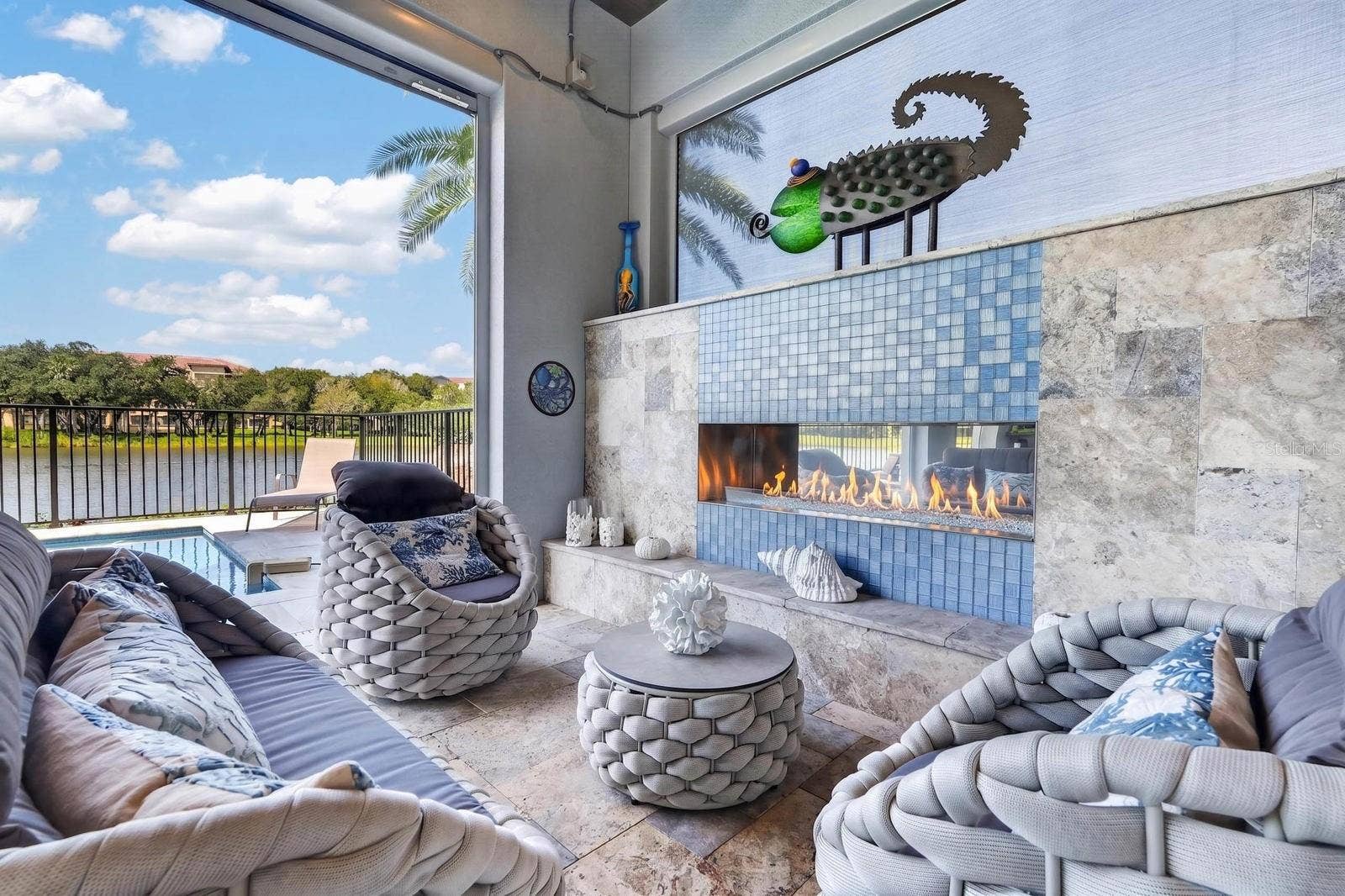 304 YACHT HARBOR DRIVE, Palm Coast, FL 32137 Indoor-outdoor living was part of the design. Covered poolside living with an outdoor gas fireplace, custom hurricane-rated screens and uninterrupted views of the Intracoastal.