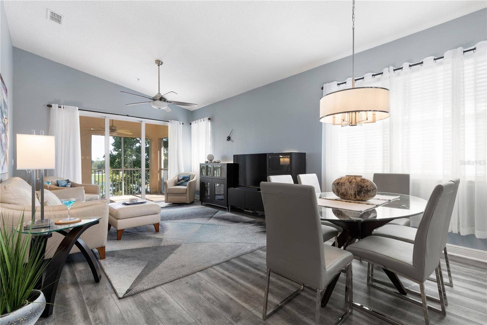 65 RIVERVIEW BEND S, #1734, Palm Coast, FL 32137 Open Living/dining area with triple sliding glass doors