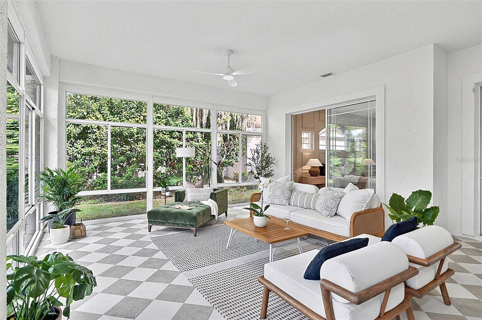 17 GRANDVIEW DRIVE, Palm Coast, FL 32137 Peaceful Solarium with wall to wall enclosed screened windows looking out on to backyard and golf course. Room is aired
