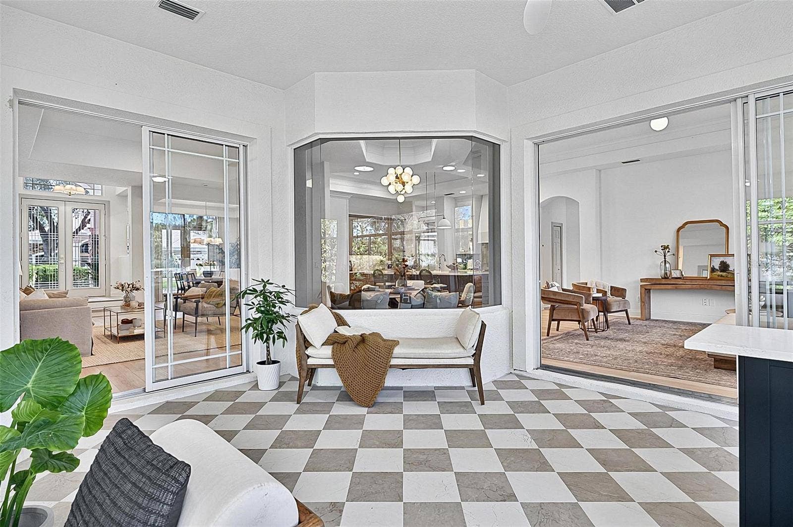 17 GRANDVIEW DRIVE, Palm Coast, FL 32137 Peaceful Solarium with wall to wall enclosed screened windows looking out on to backyard and golf course. Room is aired and is open to Formal living room and family room