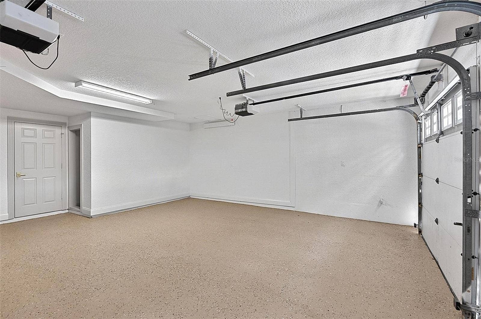 17 GRANDVIEW DRIVE, Palm Coast, FL 32137 Oversized double door garage with epoxy floor and extra storage area