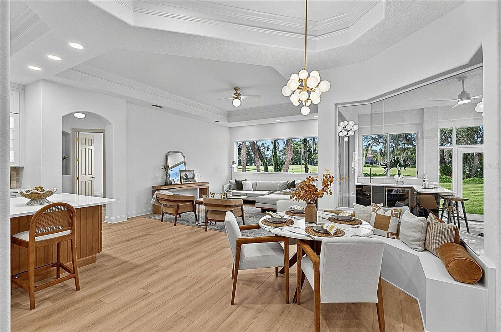 17 GRANDVIEW DRIVE, Palm Coast, FL 32137 Spectacular Kitchen, cozy breakfast nook with bench setting, seamless window looking out to soliarium and family room with wall of windows for an execlant view of backyard and golf course