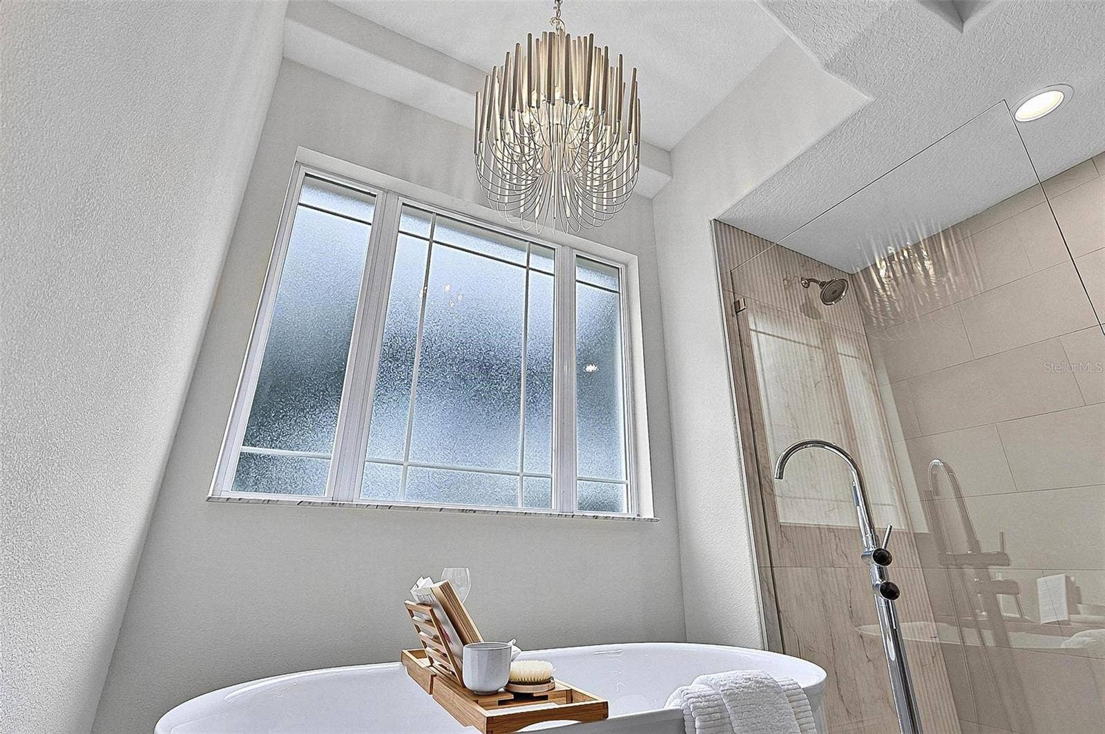 17 GRANDVIEW DRIVE, Palm Coast, FL 32137 Beautiful chandelier drops over the free standing tub for a nigh time spa glow
