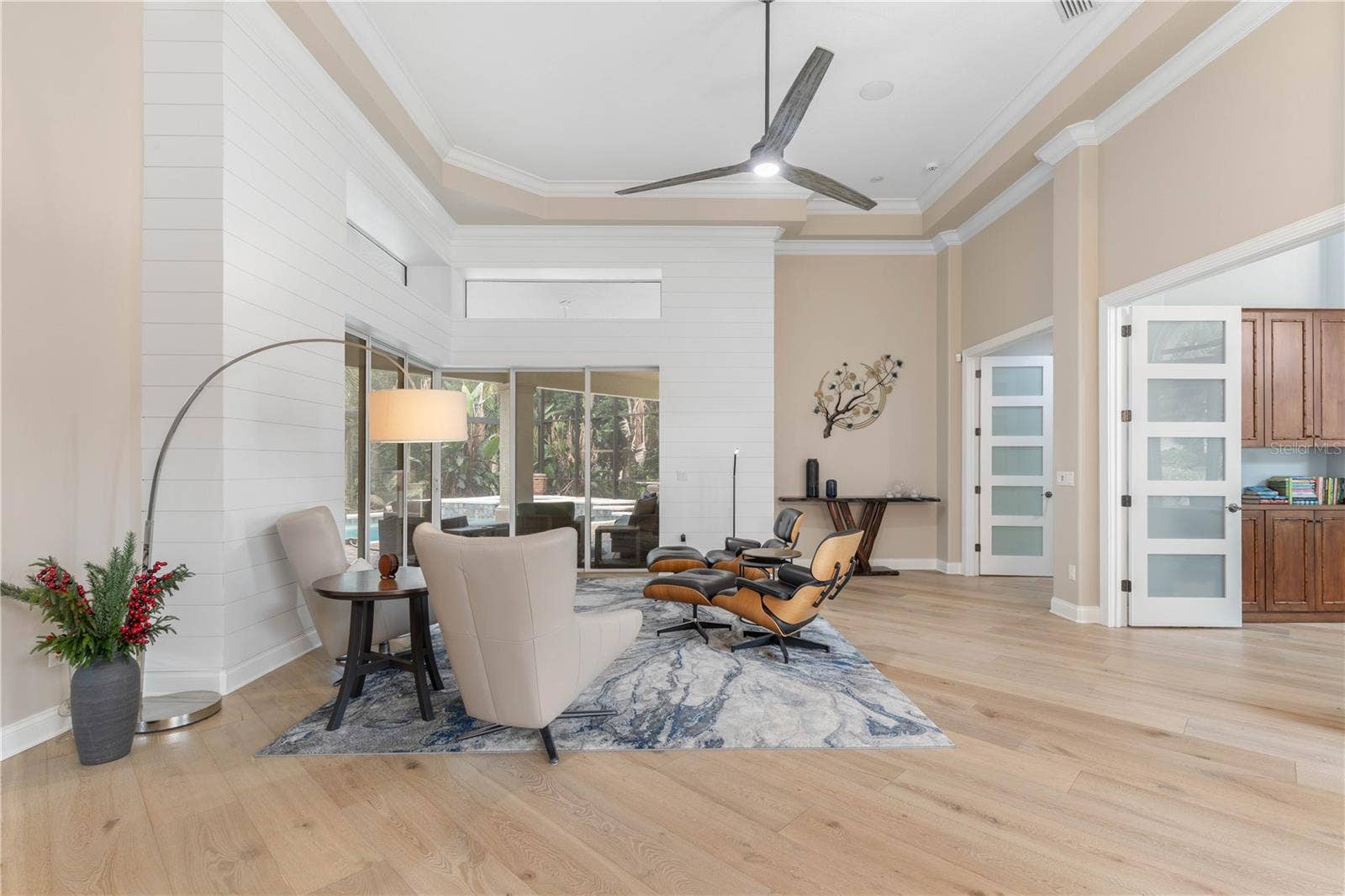 Step into a space where sunlight dances across wide-plank floors and modern elegance meets easy comfortthis inviting living area feels like the start of your next chapter.