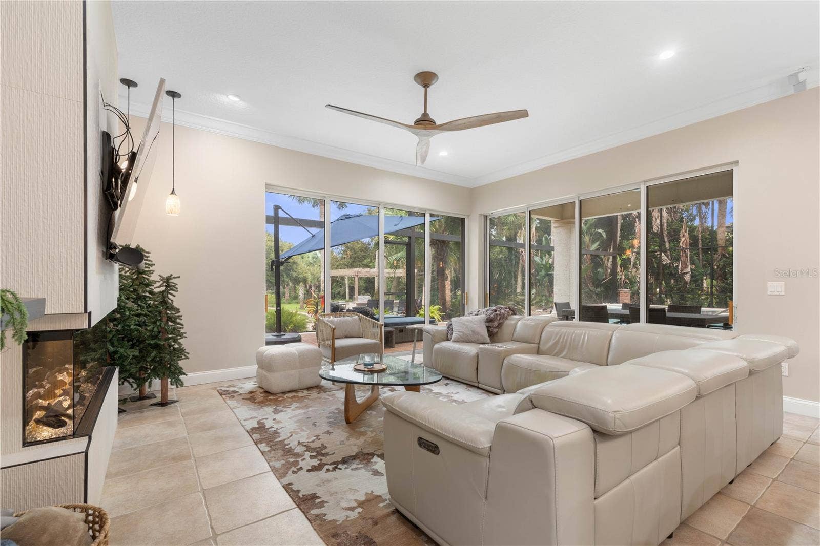 Designed to flow straight to the pool, this family room makes it easy to move from relaxed indoor living to sunny afternoons and evening swims.