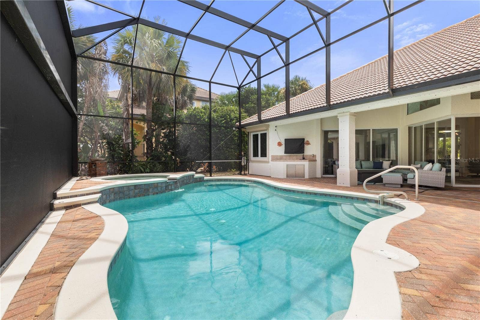 From refreshing morning swims to a late-night soak in the spa, this screened pool setting turns the backyard into a destination all its own.