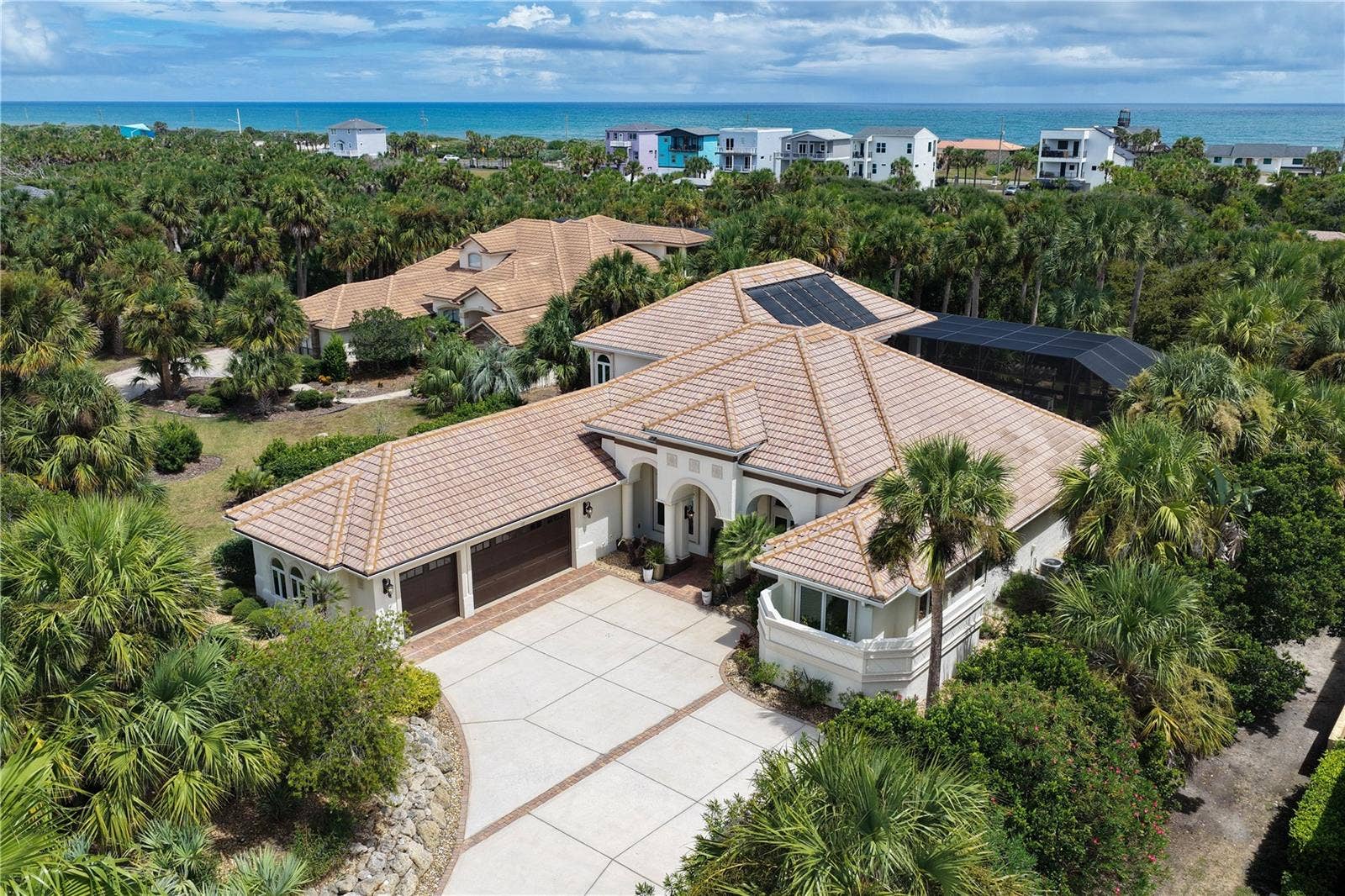 From the moment you arrive, 113 Island Estates Pkwy feels distinctly private and refinedan elegant estate tucked into its coastal surroundings with the blue Atlantic waiting just beyond.