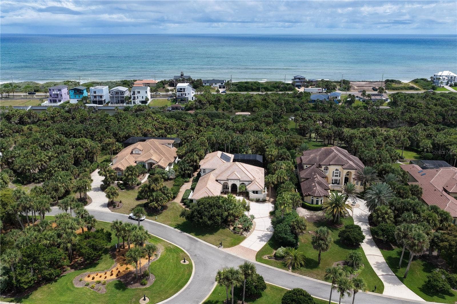 Framed by a lush canopy of palms with the Atlantic commanding the horizon, 113 Island Estates Pkwy enjoys an extraordinary coastal setting where privacy, prestige and the beauty of Floridas shoreline come together.