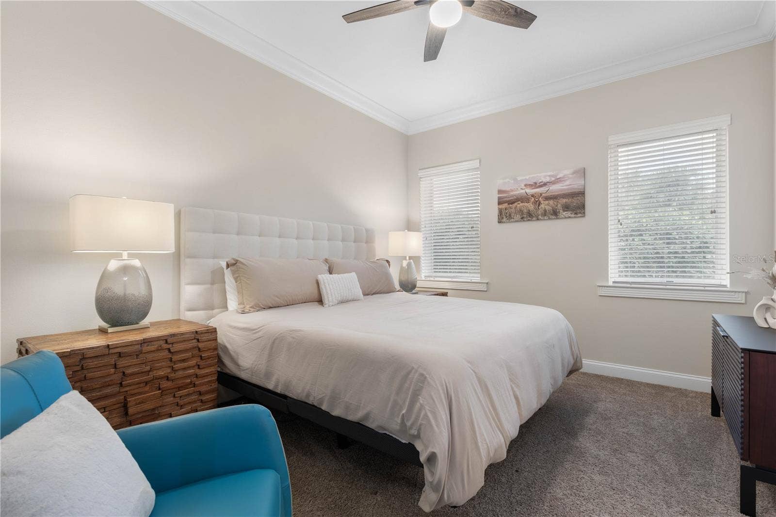 A comfortable guest bedroom with plenty of room to settle inwhether staying for a weekend or lingering a little longer.