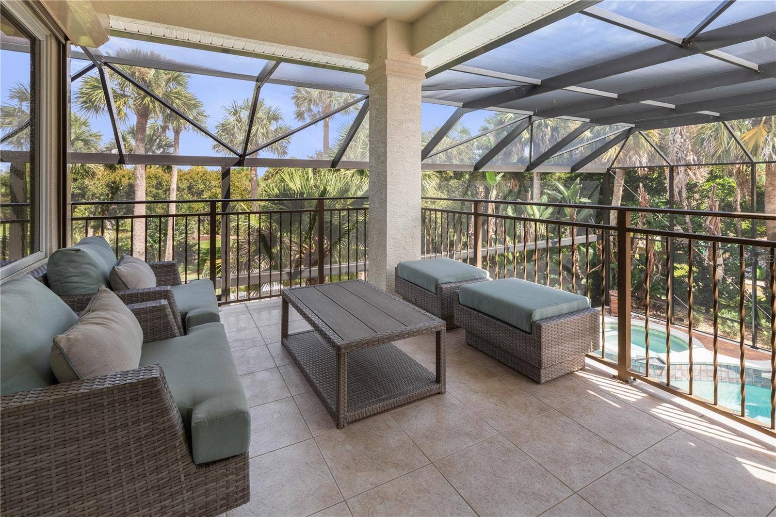 Just beyond the game room, the private balcony offers a breezy perch above the poolperfect for slipping outside with a morning coffee or evening cocktail.