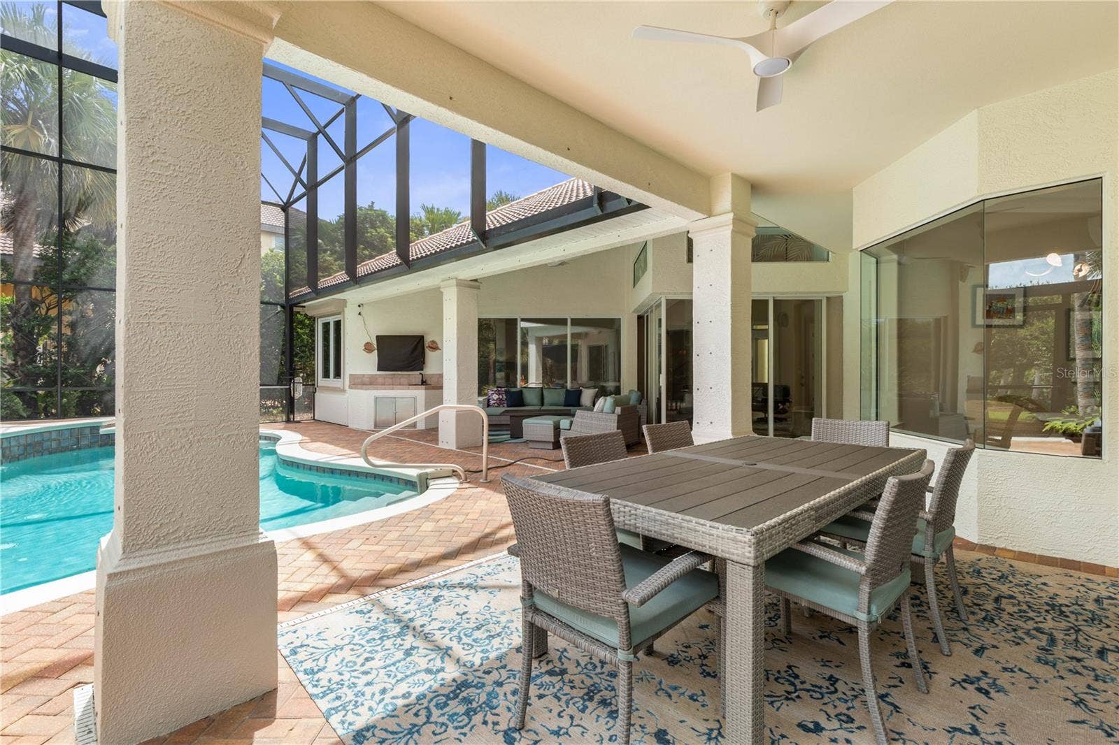 Made for long lunches that turn into lazy afternoonsthis covered poolside dining space keeps every gathering close to the water.