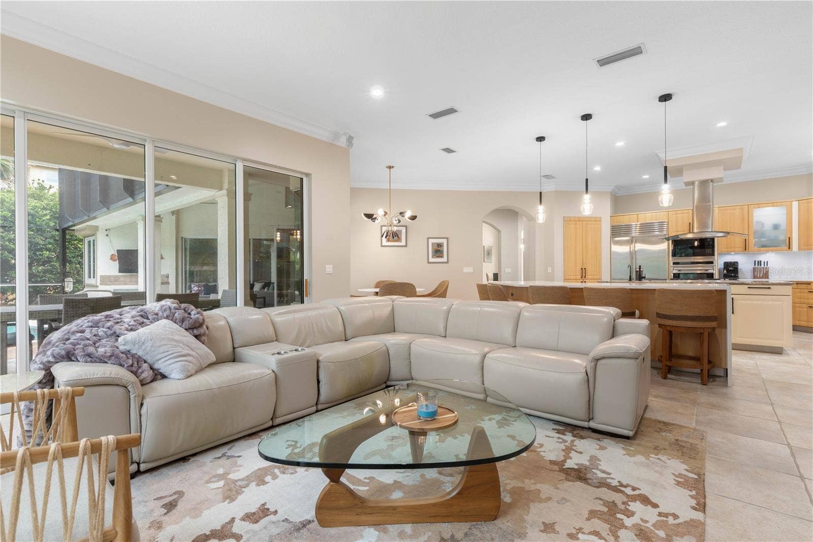 This is where the home comes alivean expansive setting where the kitchen, casual dining and family room come together beautifully for everything from quiet nights in to a house full of guests.