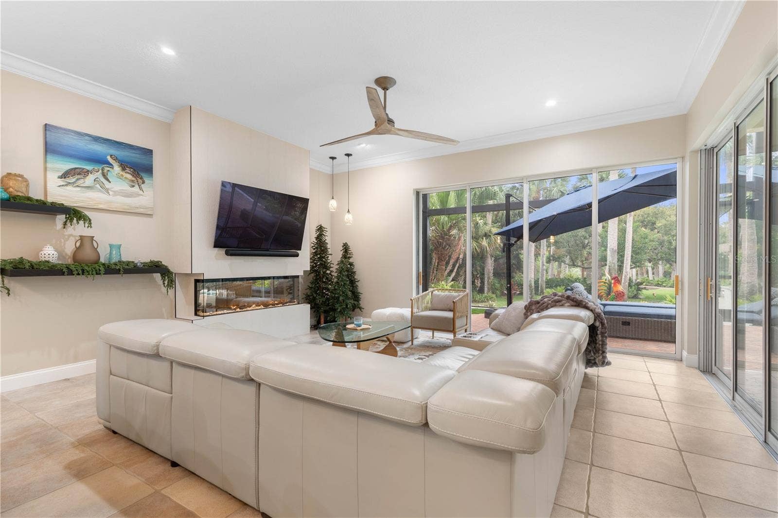 Made for unwinding, the family room pairs fireside comfort with wide-open views to the outdoor living beyondone of those spaces that makes staying home feel like a luxury.