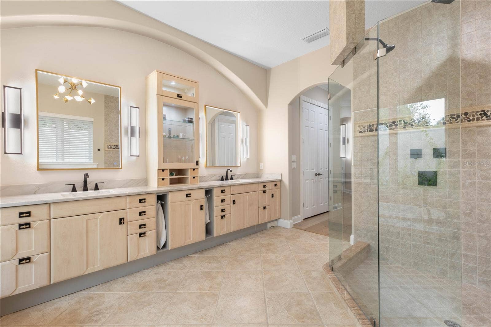 Plenty of room for twoand no fighting over the sink. Dual vanities, abundant storage make busy mornings feel effortless.