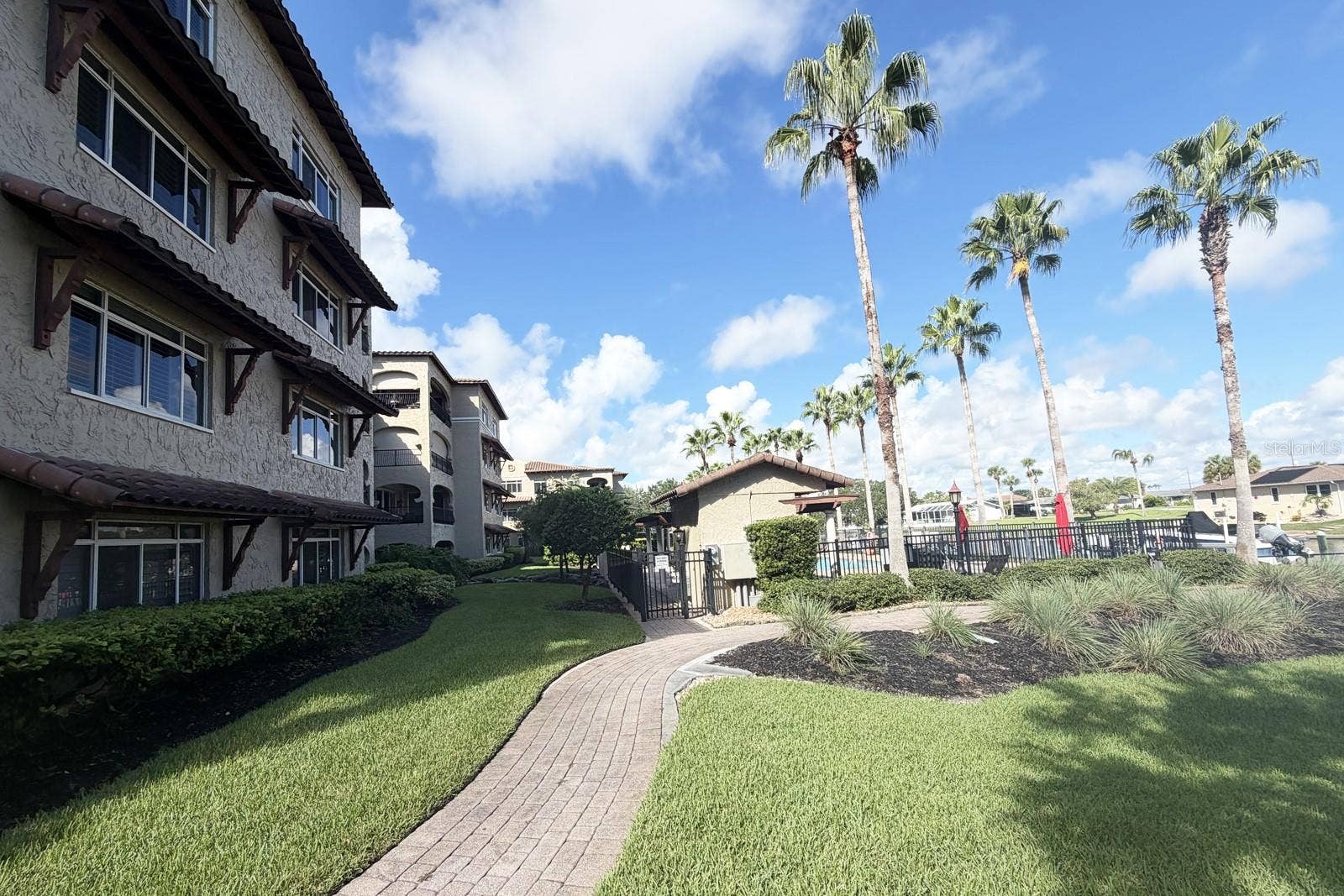 112 CLUB HOUSE DRIVE, #102, Palm Coast, FL 32137 Outside walkway to Pool