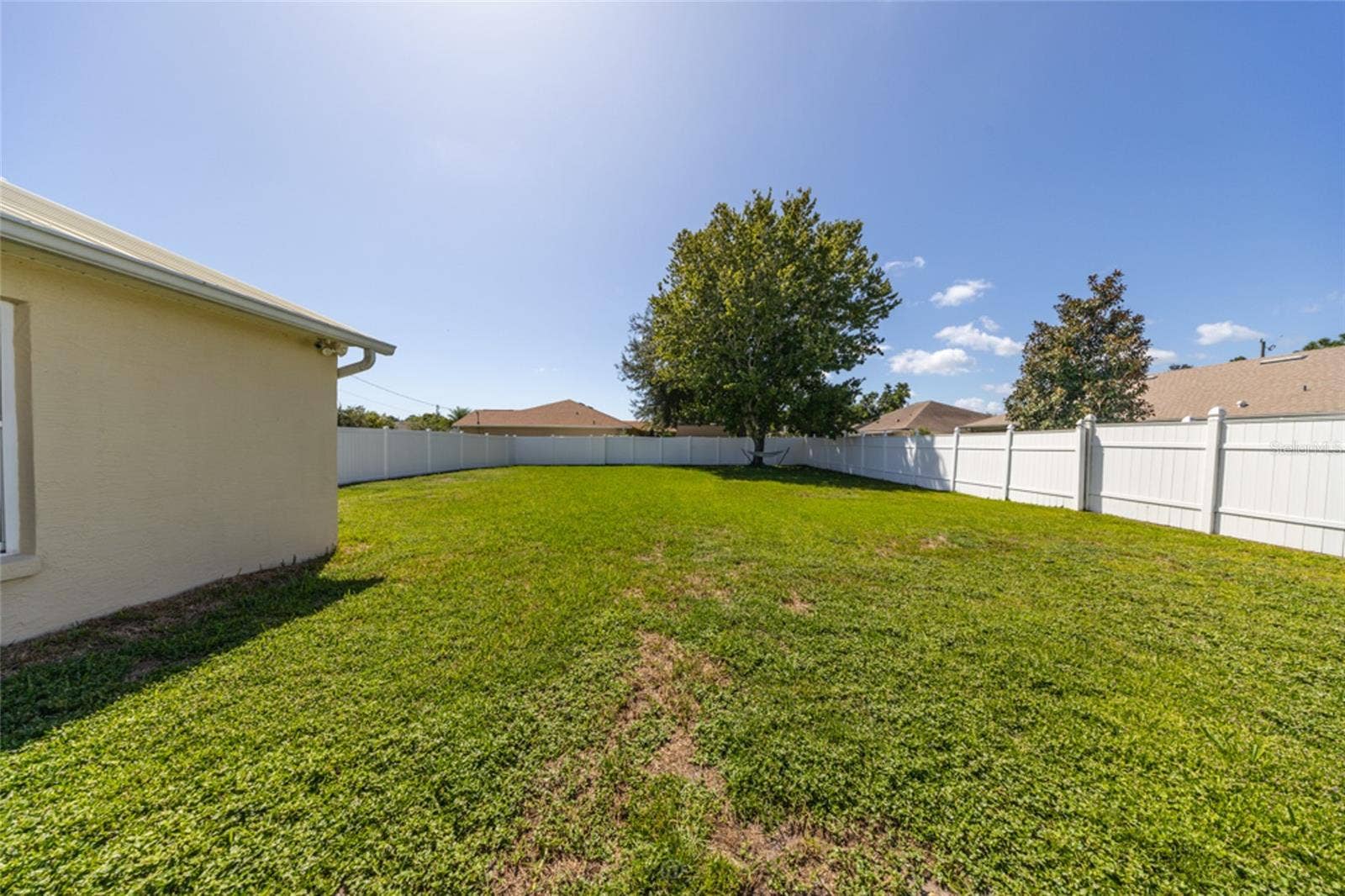 view from the pool area to the side yard