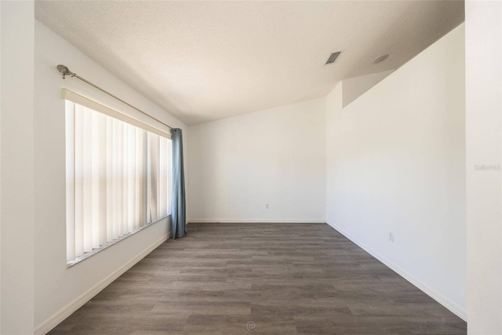 formal living room could convert to a 4th bedroom or office