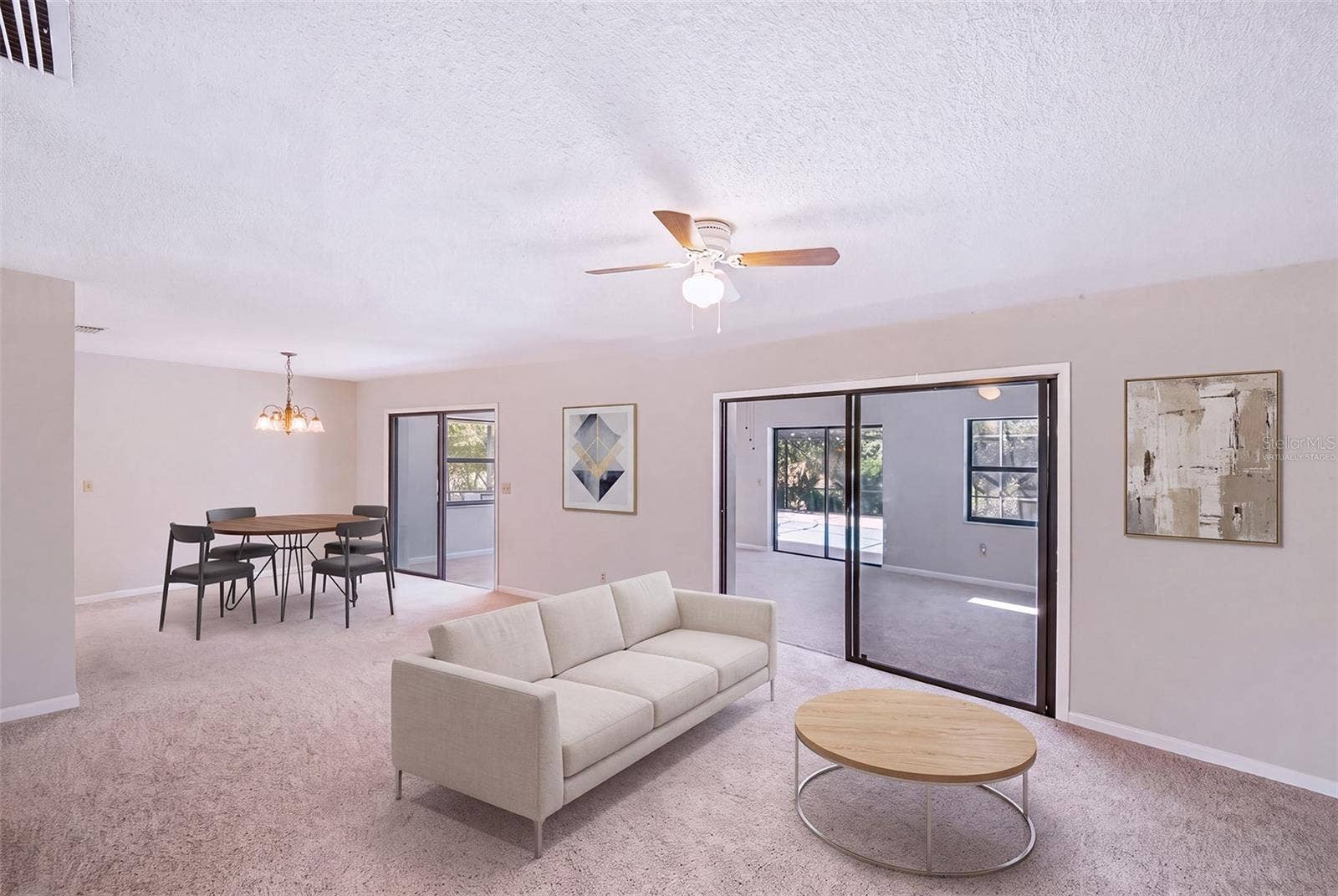 83 FARRAGUT DRIVE, Palm Coast, FL 32137 Virtually staged with furniture in dinette/living room area