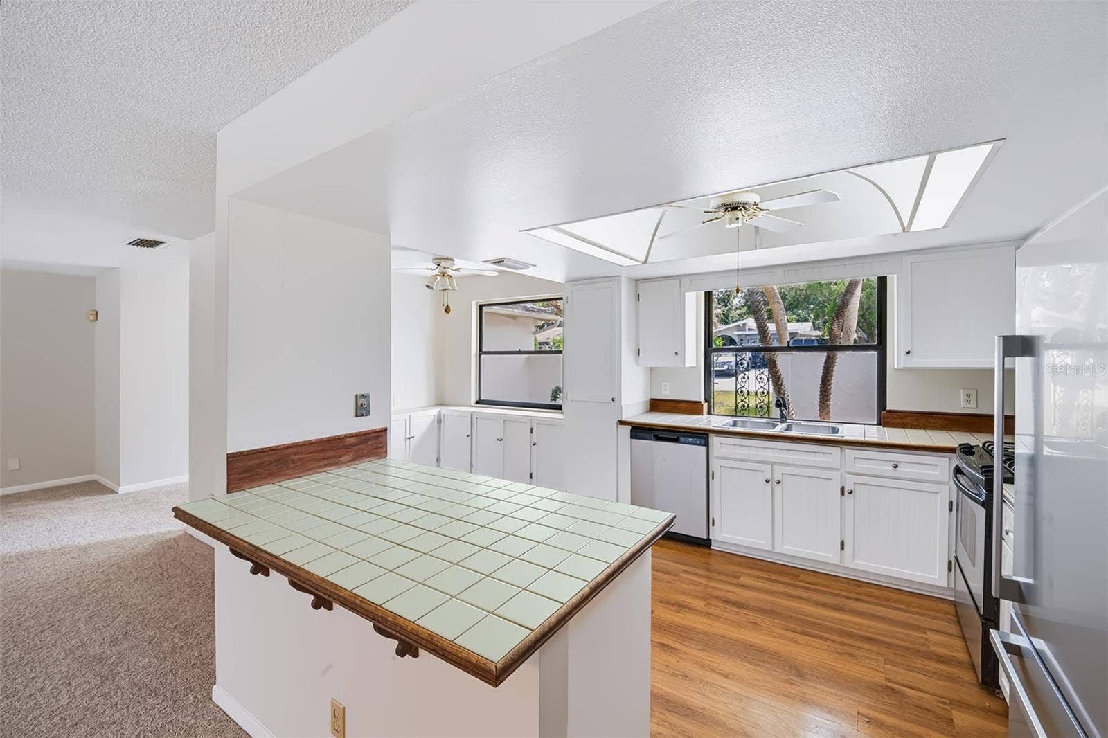 83 FARRAGUT DRIVE, Palm Coast, FL 32137 View from the dinette small breakfast bar area into the kitchen