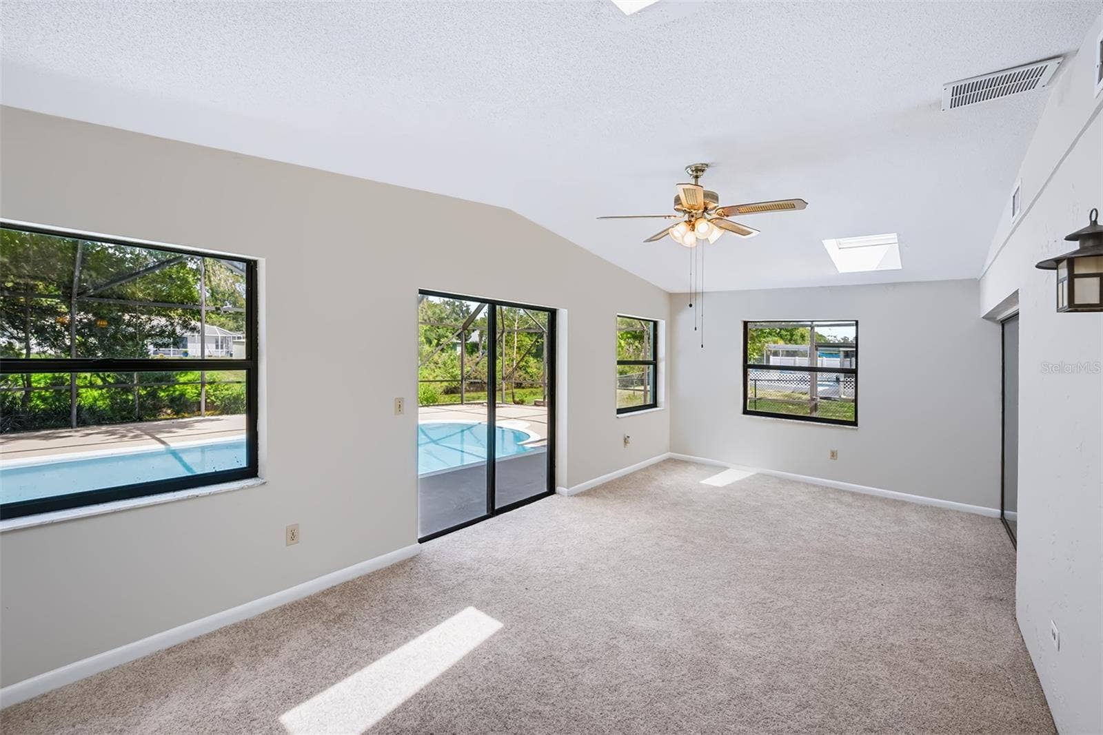 83 FARRAGUT DRIVE, Palm Coast, FL 32137 Large Florida room with 2 skylights and celing fan