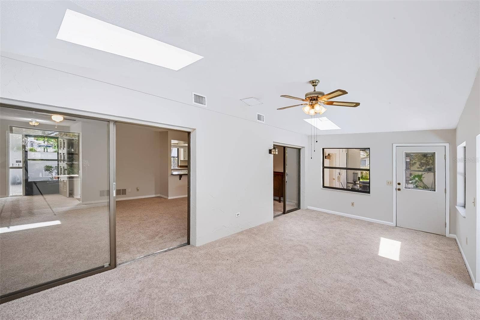 83 FARRAGUT DRIVE, Palm Coast, FL 32137 Another view from the Florida room toward the living room/dinette area