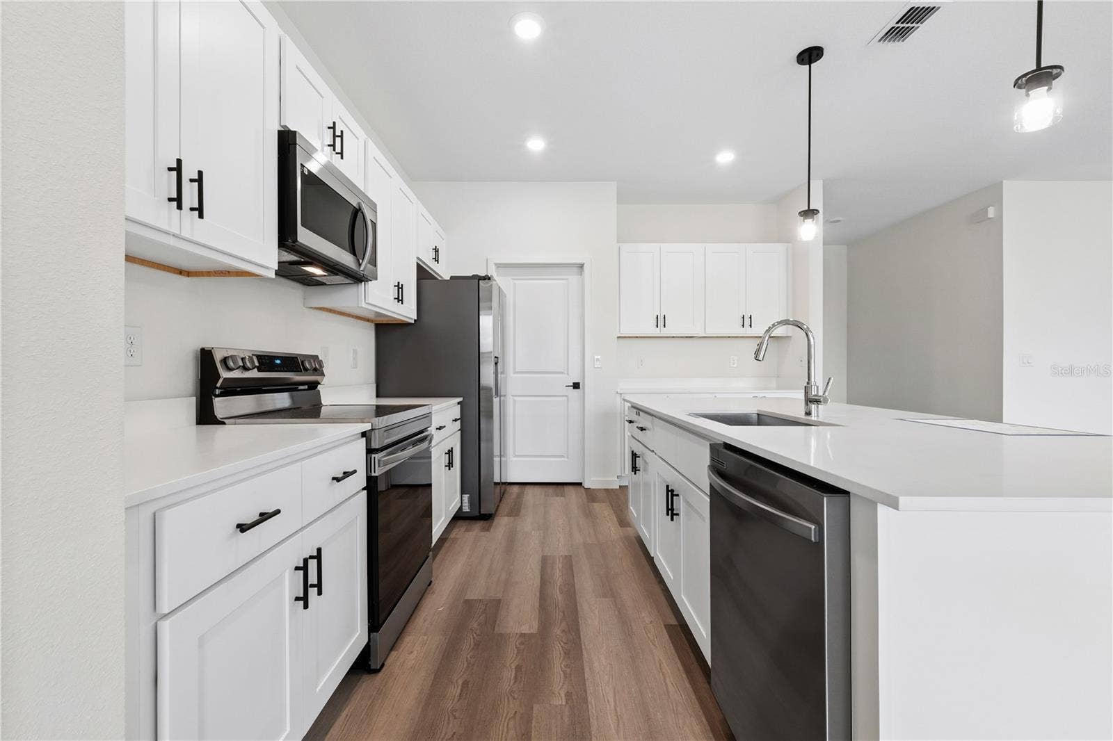 68 LAKE SUCCESS DRIVE, Palm Coast, FL 32137 Photo is of a completed model; actual colors and finishes may vary.