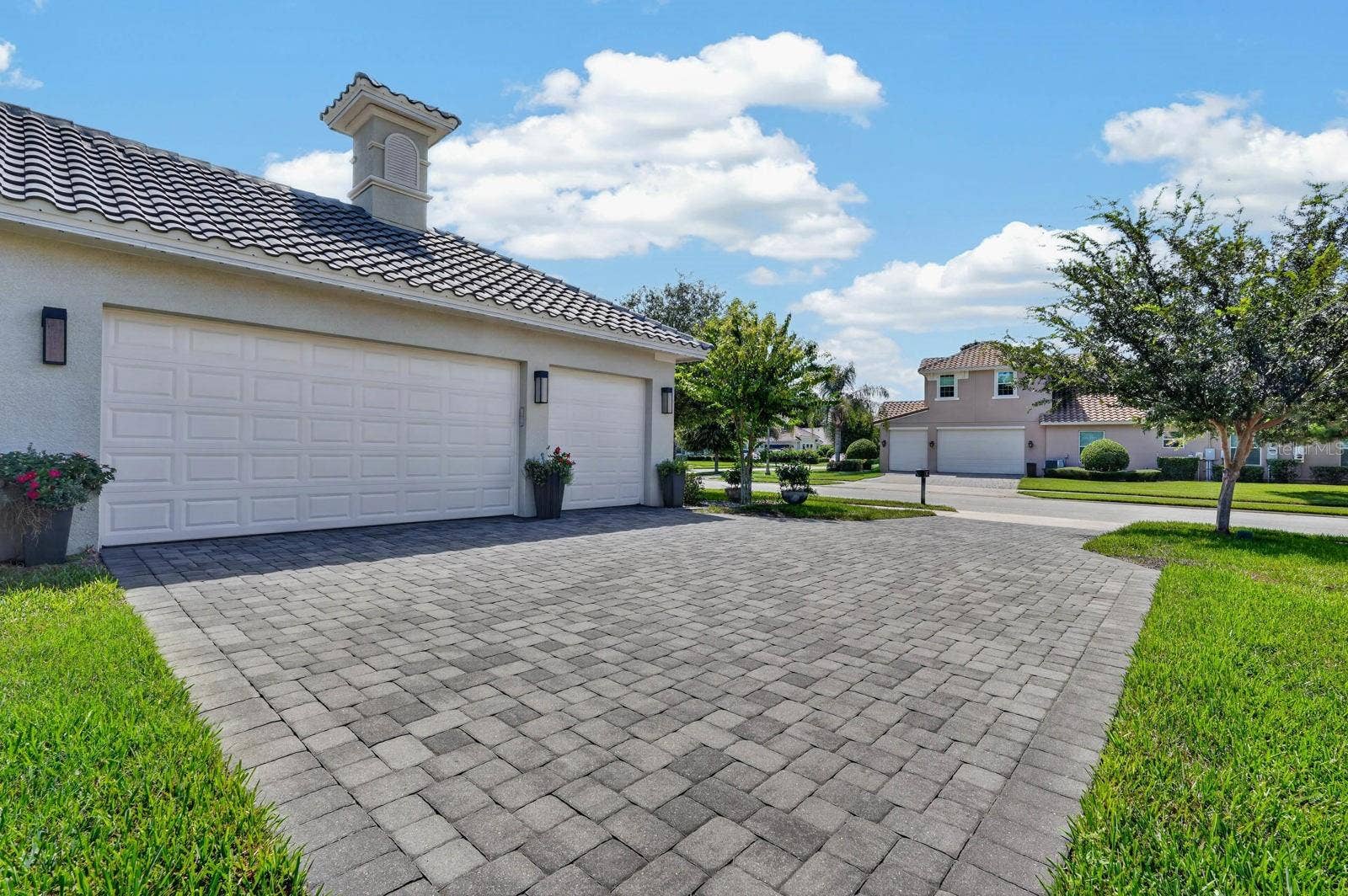 36 NEW WATER OAK DRIVE, Palm Coast, FL 32137 paver driveway offers plenty of room for guest parking plus a 3 car garage