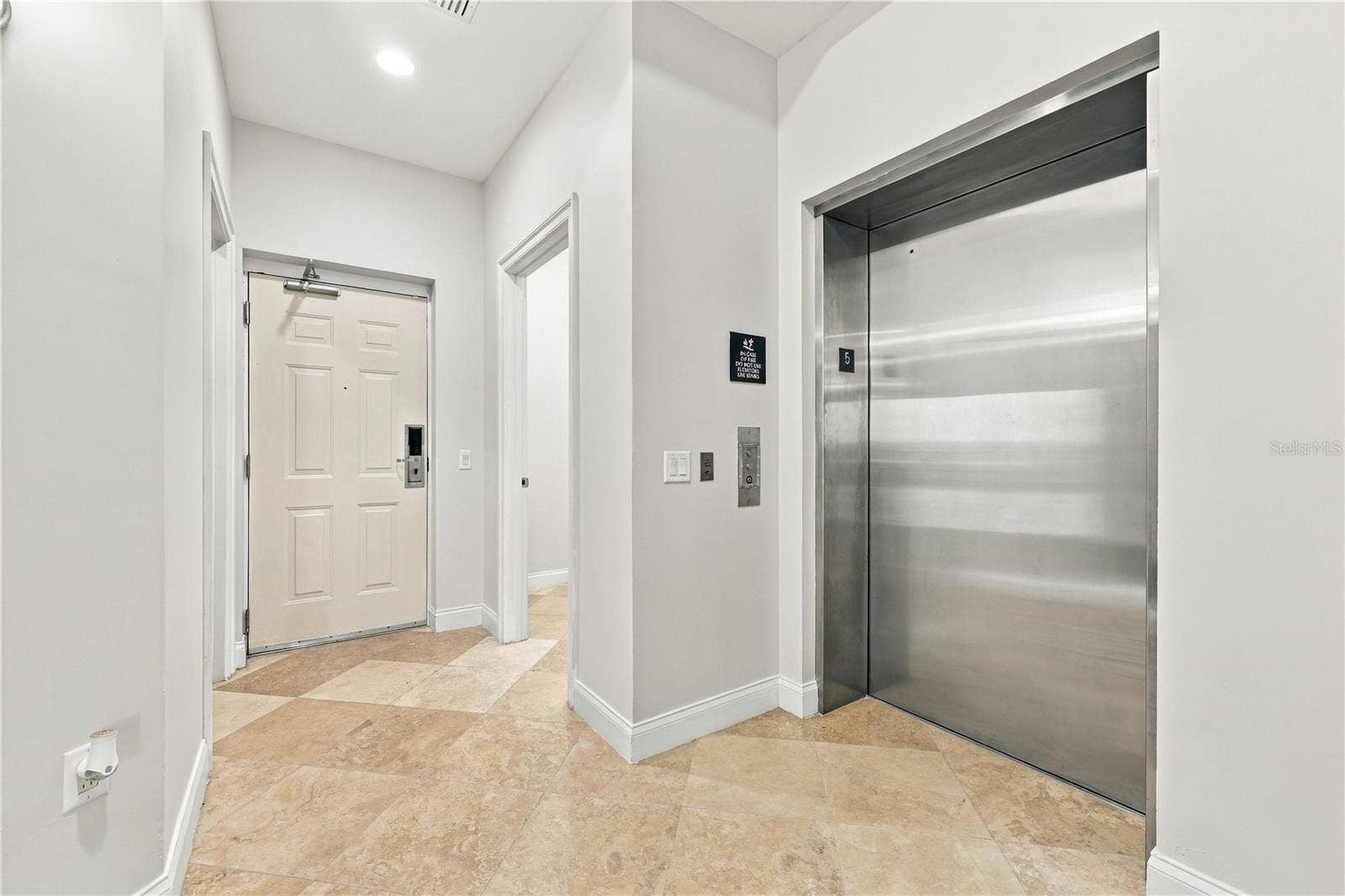 200 OCEAN CREST DRIVE, #542, Palm Coast, FL 32137 Private Elevator Entrance into Condo