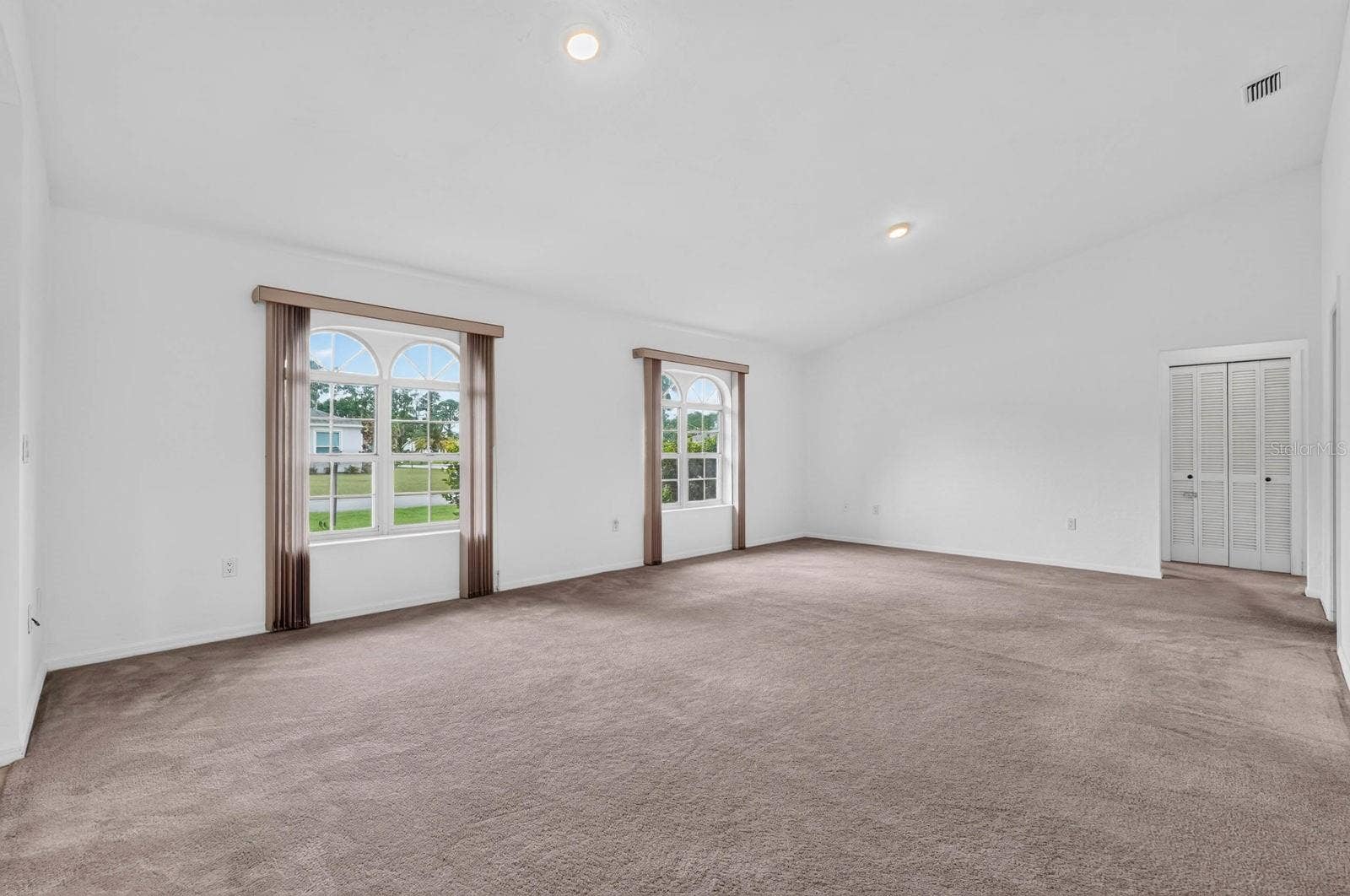 large living room with arched windows