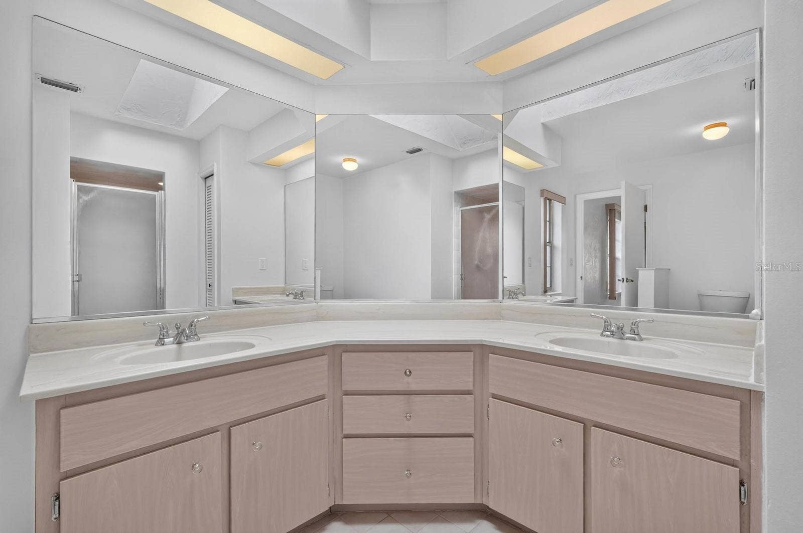 Primary bathroom has double vanity sink marble countertop