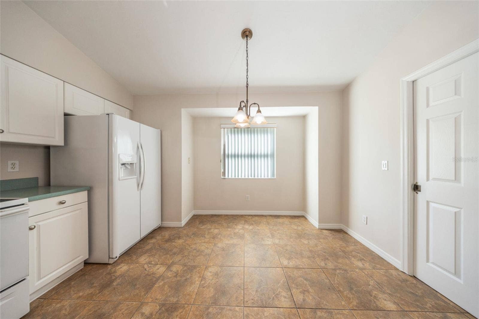 141 BREN MAR LANE, Palm Coast, FL 32137 Great spot by the window for meals. Laundry room is to the right.