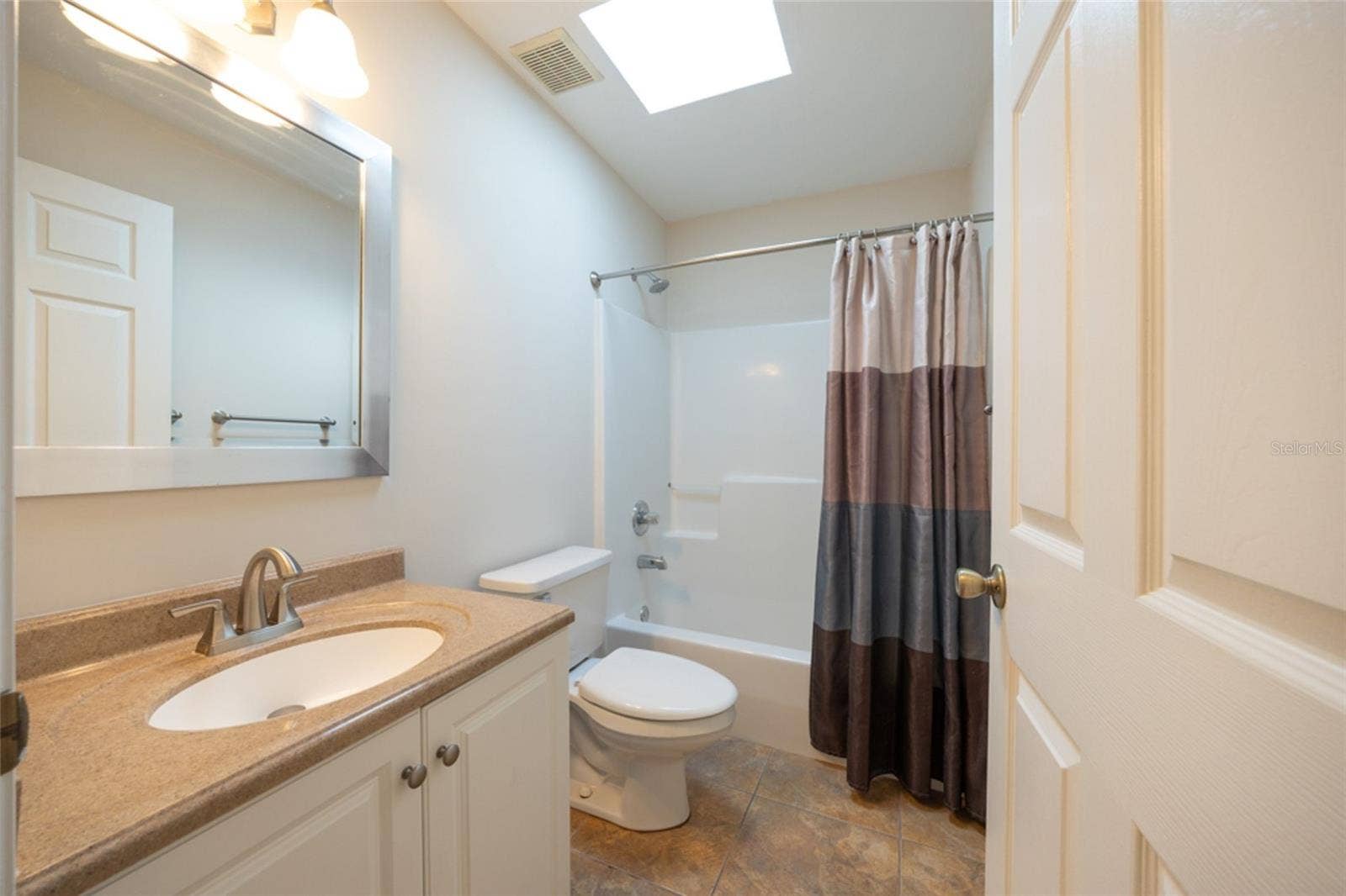 141 BREN MAR LANE, Palm Coast, FL 32137 Guest bathroom has solid surface countertops and easy clean shower