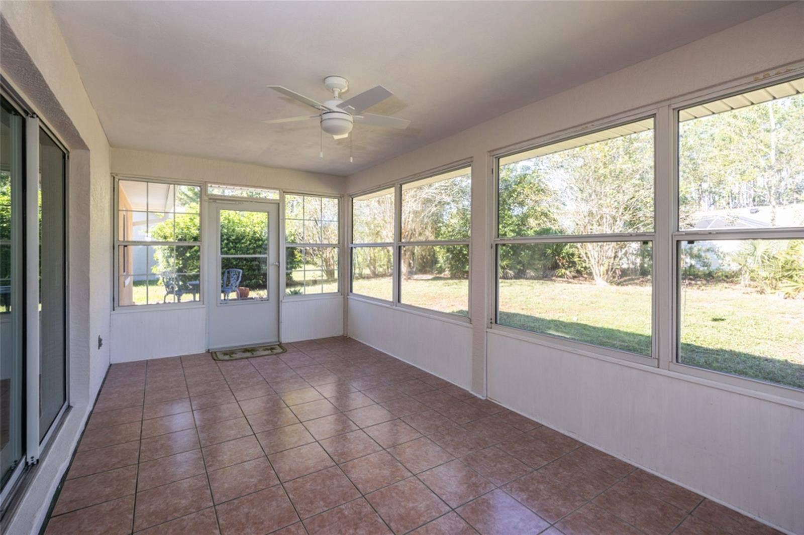 141 BREN MAR LANE, Palm Coast, FL 32137 Florida room with tile flooring