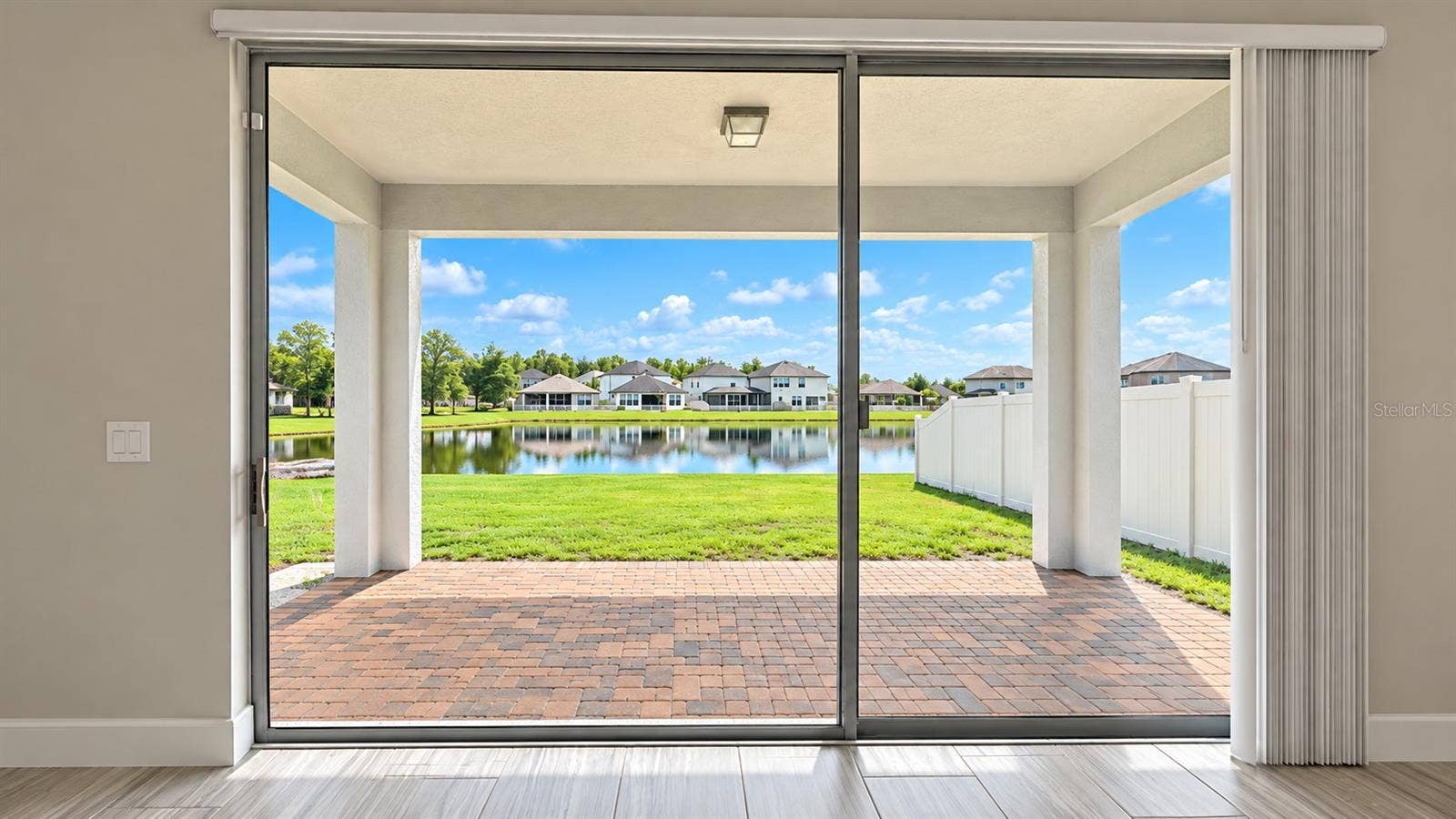 8734 WINNING FIELDS ROAD, New Port Richey, FL 34655 living room view outside