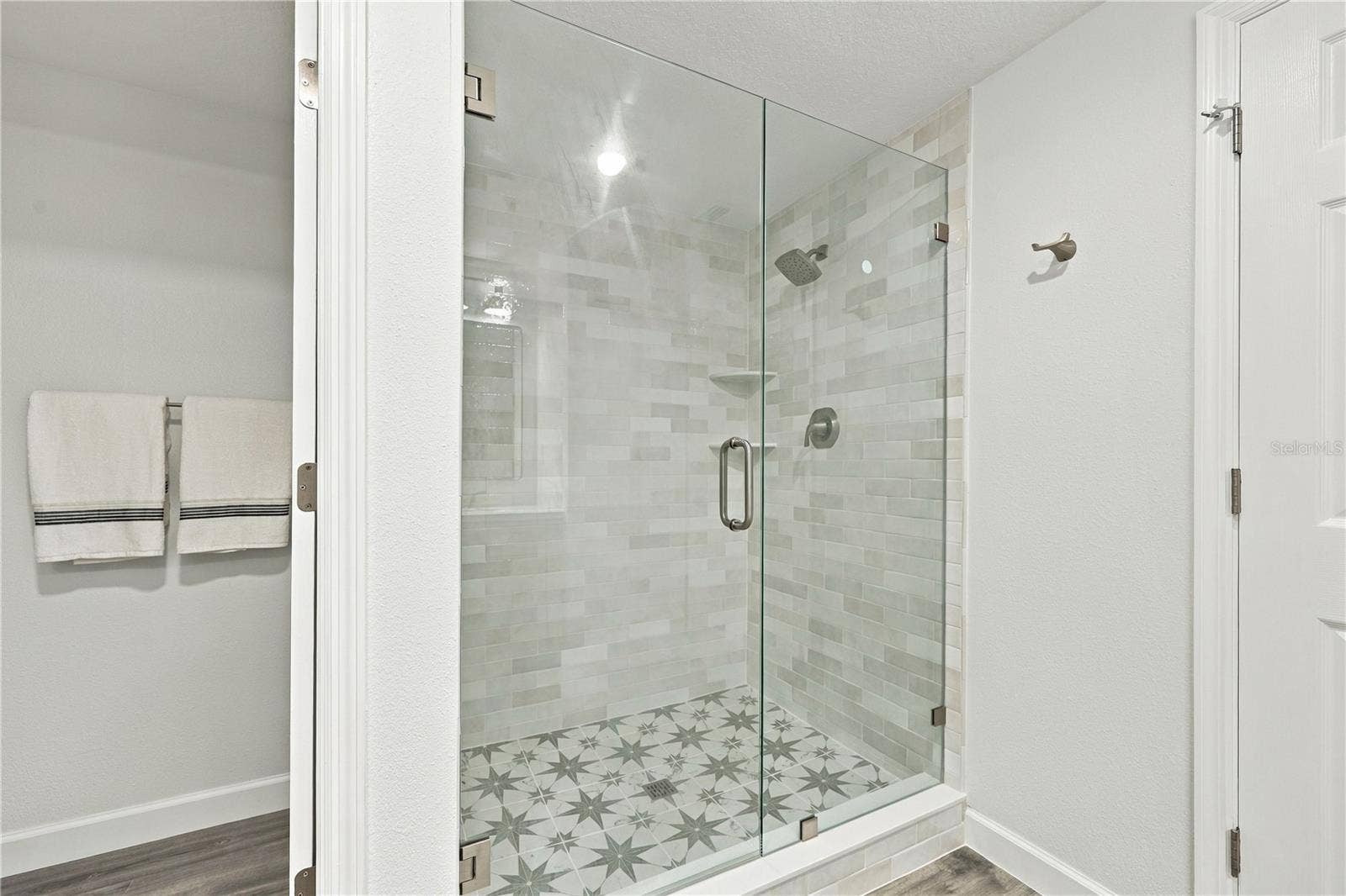 Shower and view of Water closet