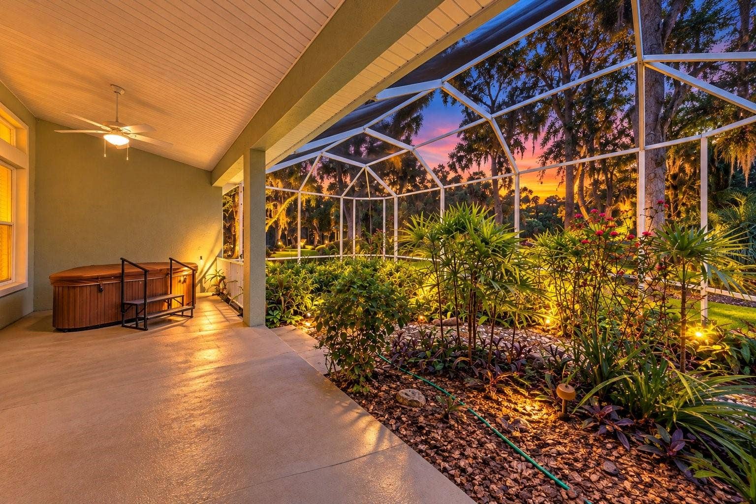 3755 CARRICK DRIVE, Ormond Beach, FL 32174 Evening view of screened in lanai