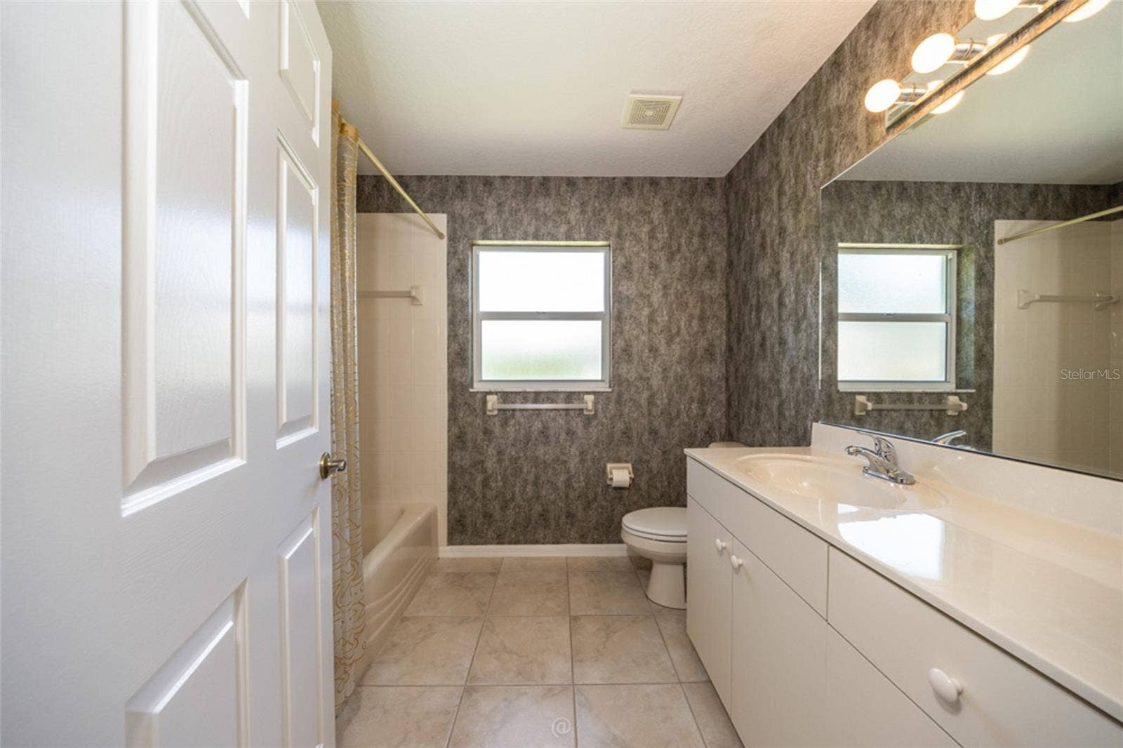 3755 CARRICK DRIVE, Ormond Beach, FL 32174 Guest bathroom with tub