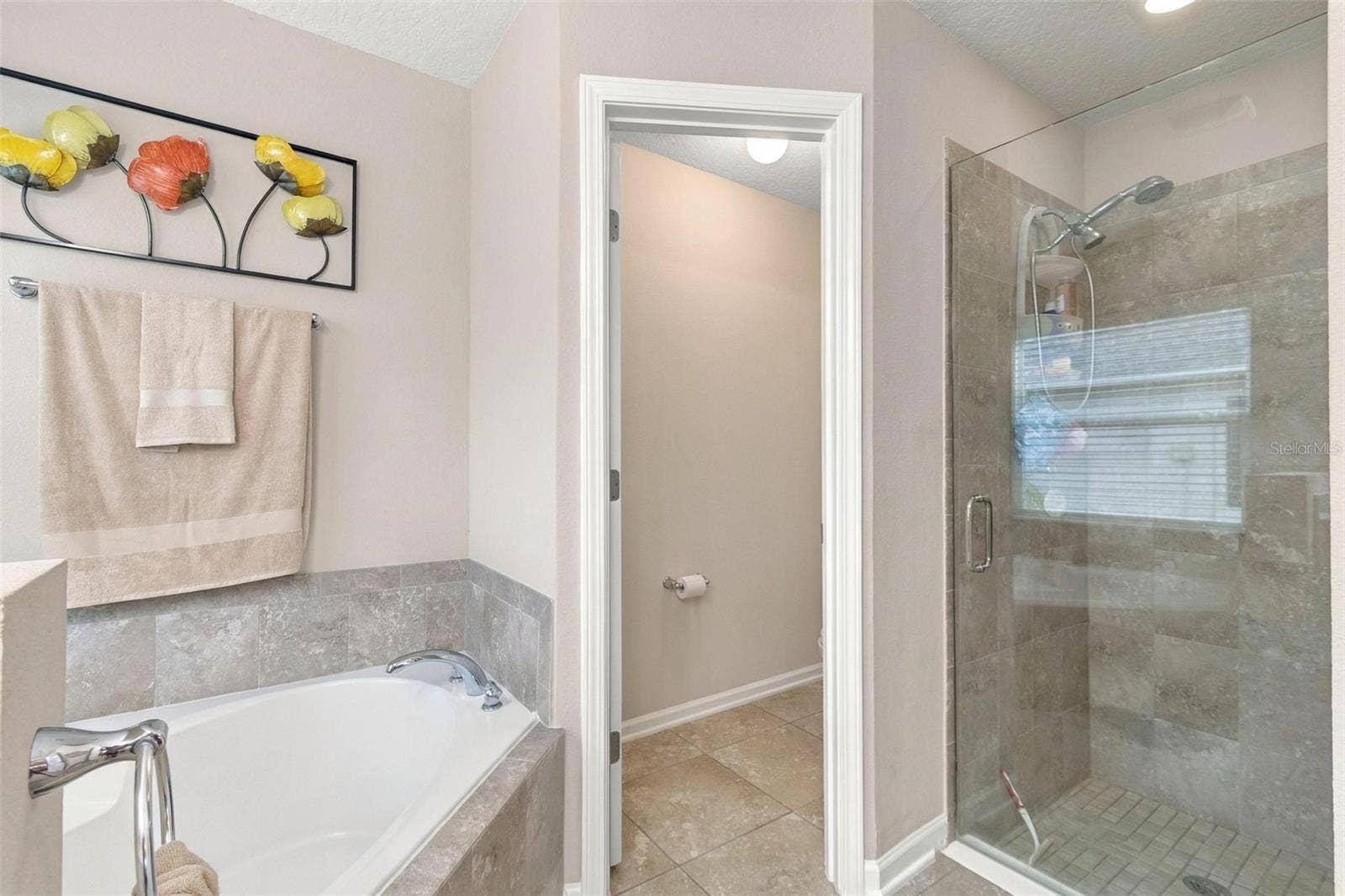 8 COUNTRY CLUB HARBOR CIRCLE, Palm Coast, FL 32137 Tub, separate shower and WC in primary ensuite bath 1