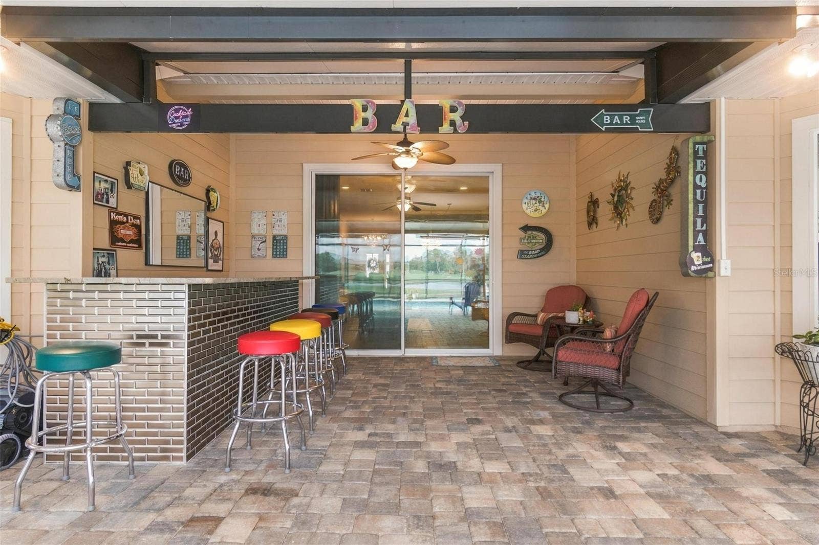 8 COUNTRY CLUB HARBOR CIRCLE, Palm Coast, FL 32137 Covered area of lanai (22 X 40) with bar
