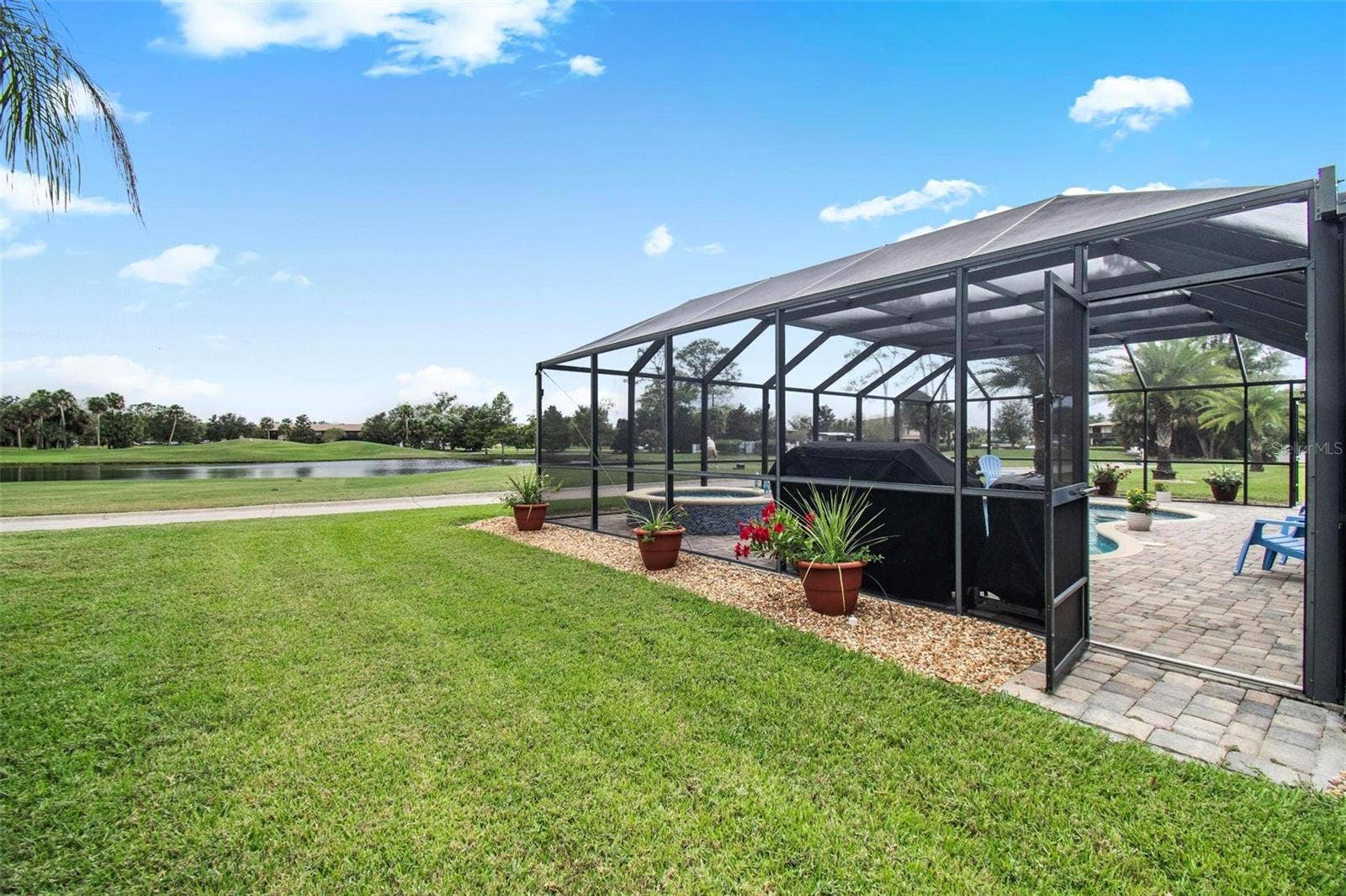 8 COUNTRY CLUB HARBOR CIRCLE, Palm Coast, FL 32137 Lanai looking to pond and golf course