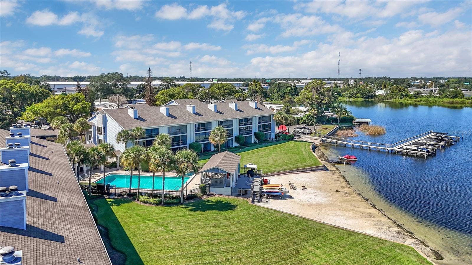 4113 FAIRVIEW VISTA POINT, #311, Orlando, FL 32804 Aerial View of Community Pool, Boat Slip, and Sandy Shoreline of Lake Fairview
