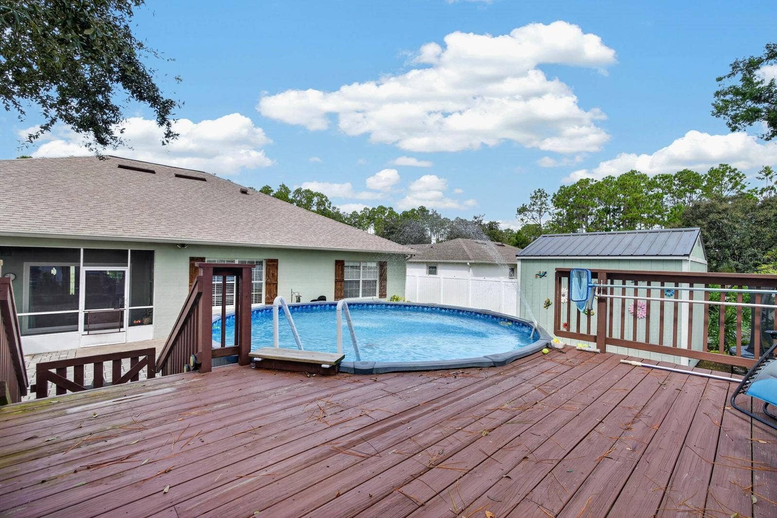72 KARAS TRAIL, Palm Coast, FL 32164 above ground pool with decking features coded gate for extra safety