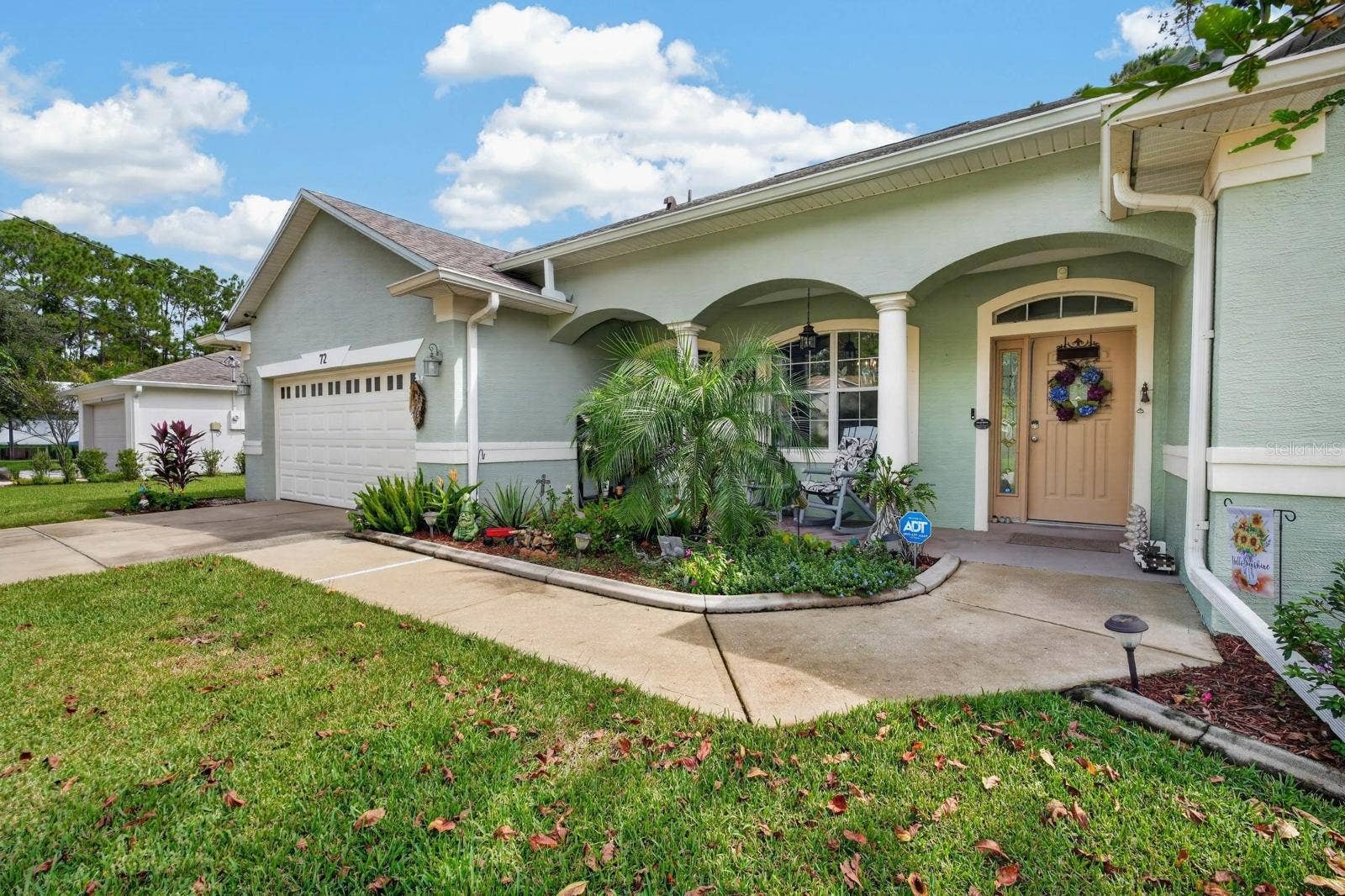 72 KARAS TRAIL, Palm Coast, FL 32164 beautiful arched architecture adds to curb appeal