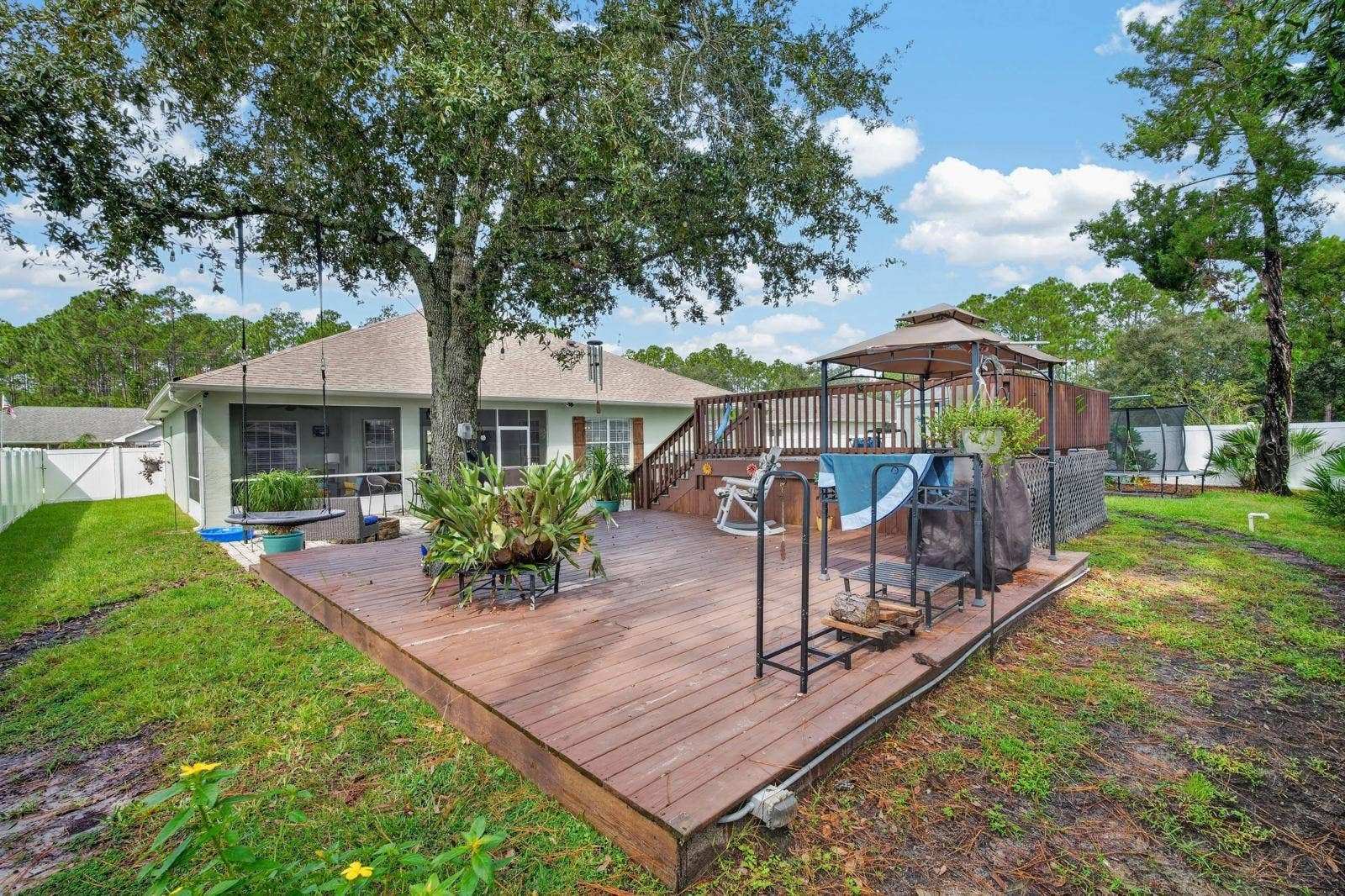 72 KARAS TRAIL, Palm Coast, FL 32164 Large deck features beautiful oak shade tree