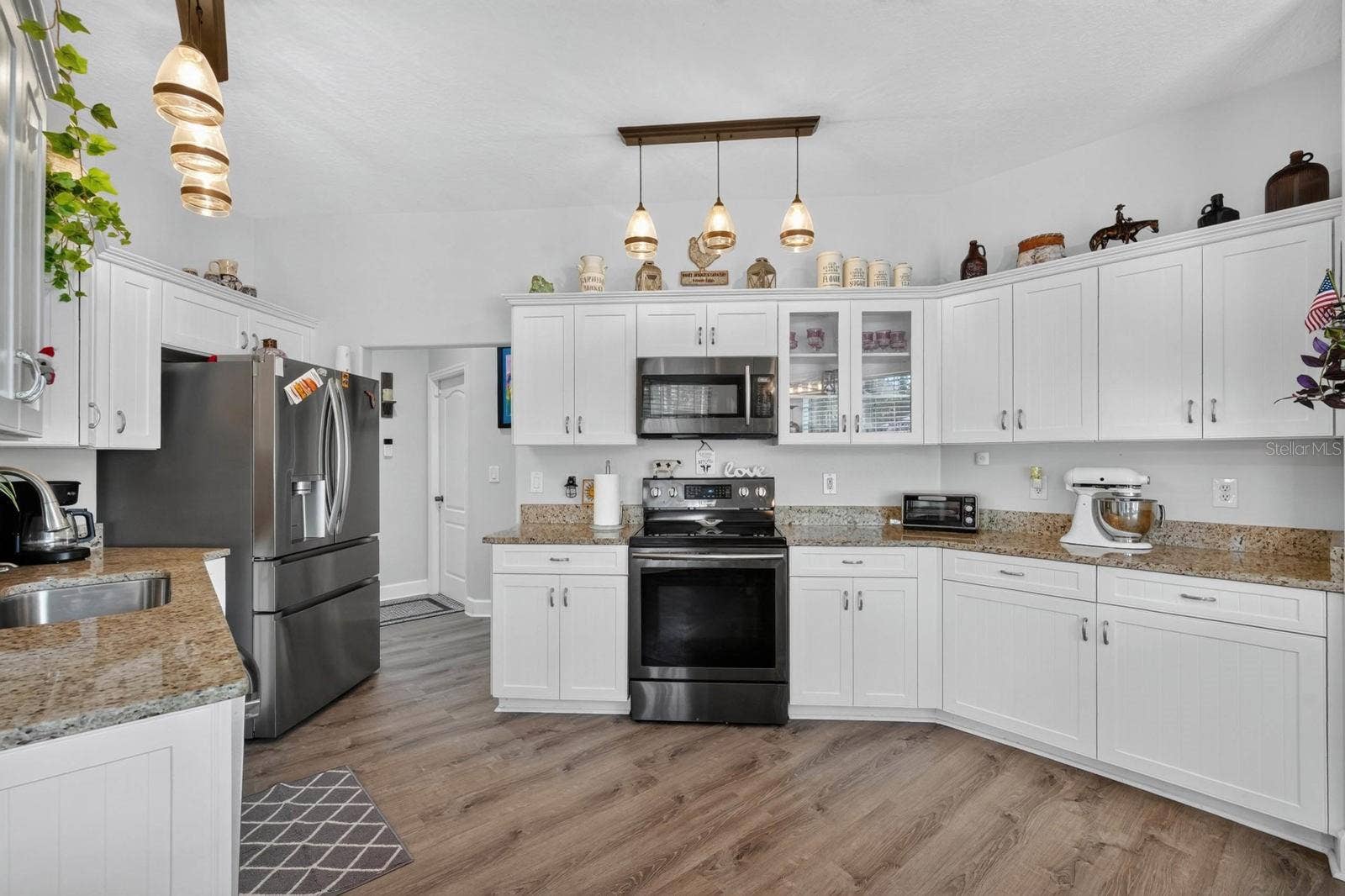 72 KARAS TRAIL, Palm Coast, FL 32164 Large kitchen with granite counters and newer stainless appliances
