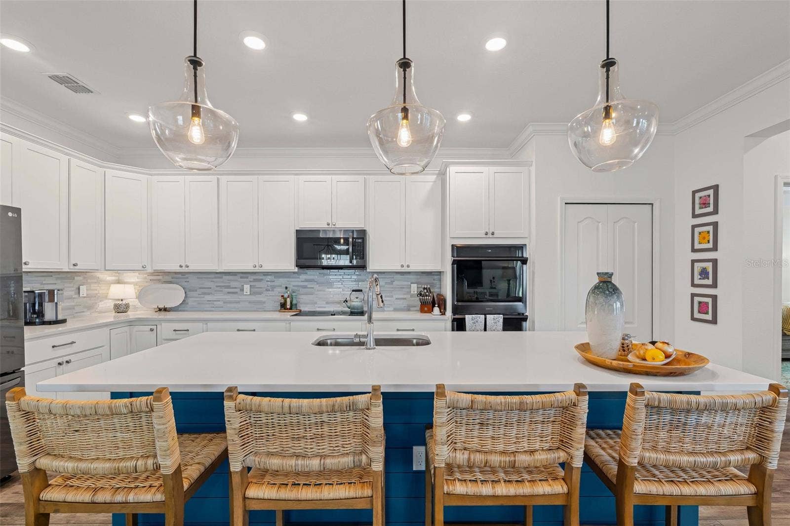 627 OCEAN JASPER DRIVE, St Augustine, FL 32086 Gourmet kitchen with tiled backsplash, double ovens, quarts countertops, and glass cooktop